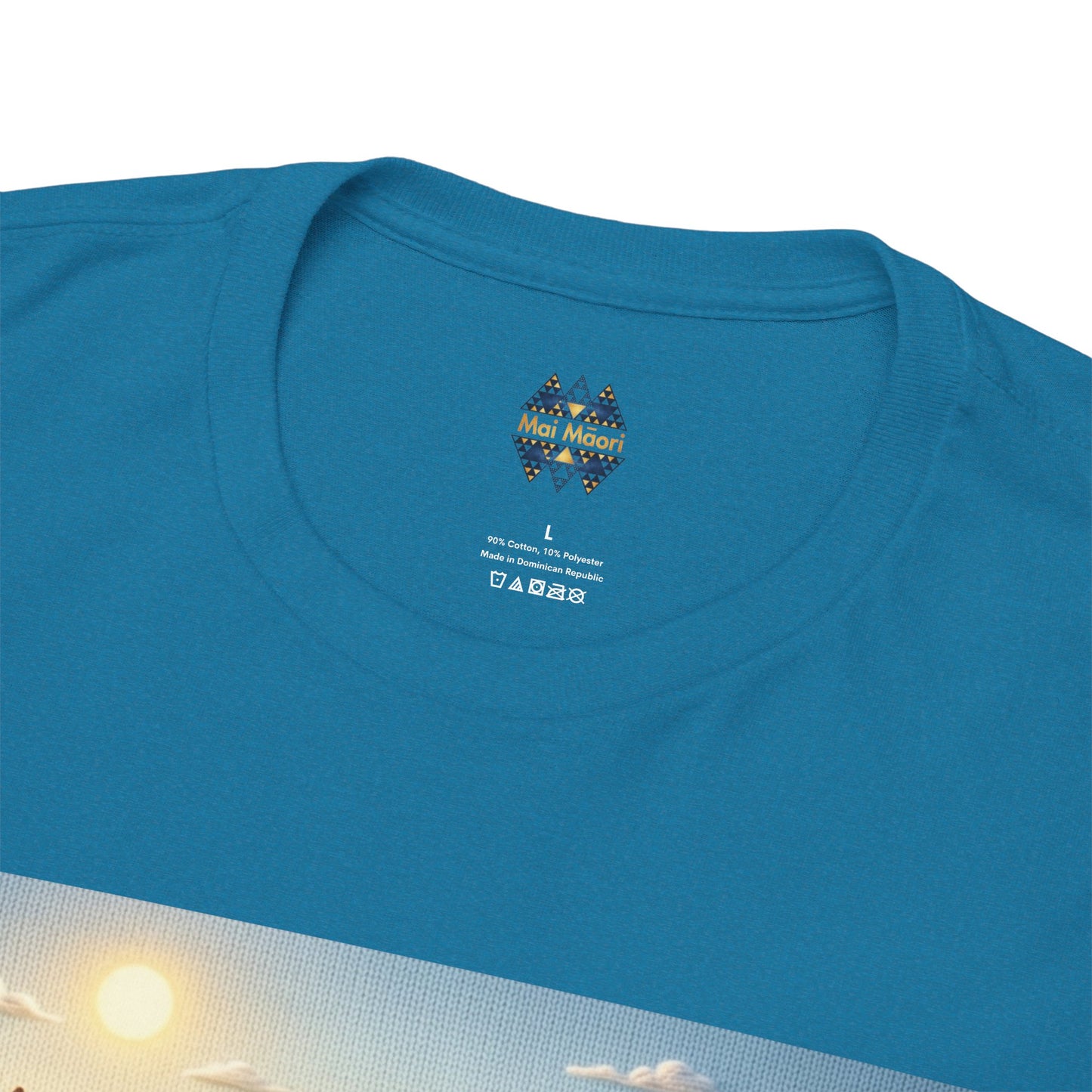 Teal T-shirt close-up of neckline and small chest emblem above partial graphic.