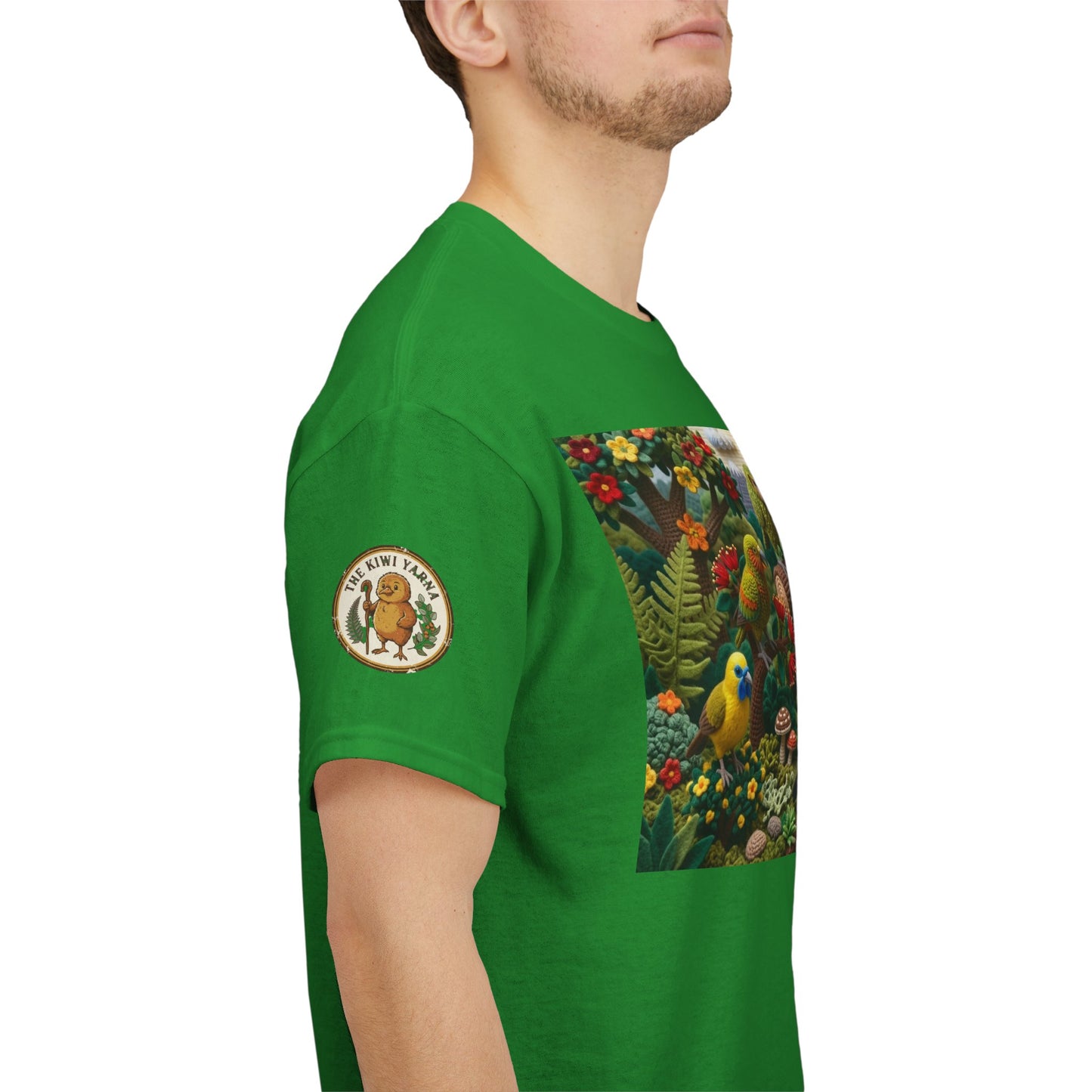 Green T-shirt side view with circular sleeve patch and chest bird graphic panel.