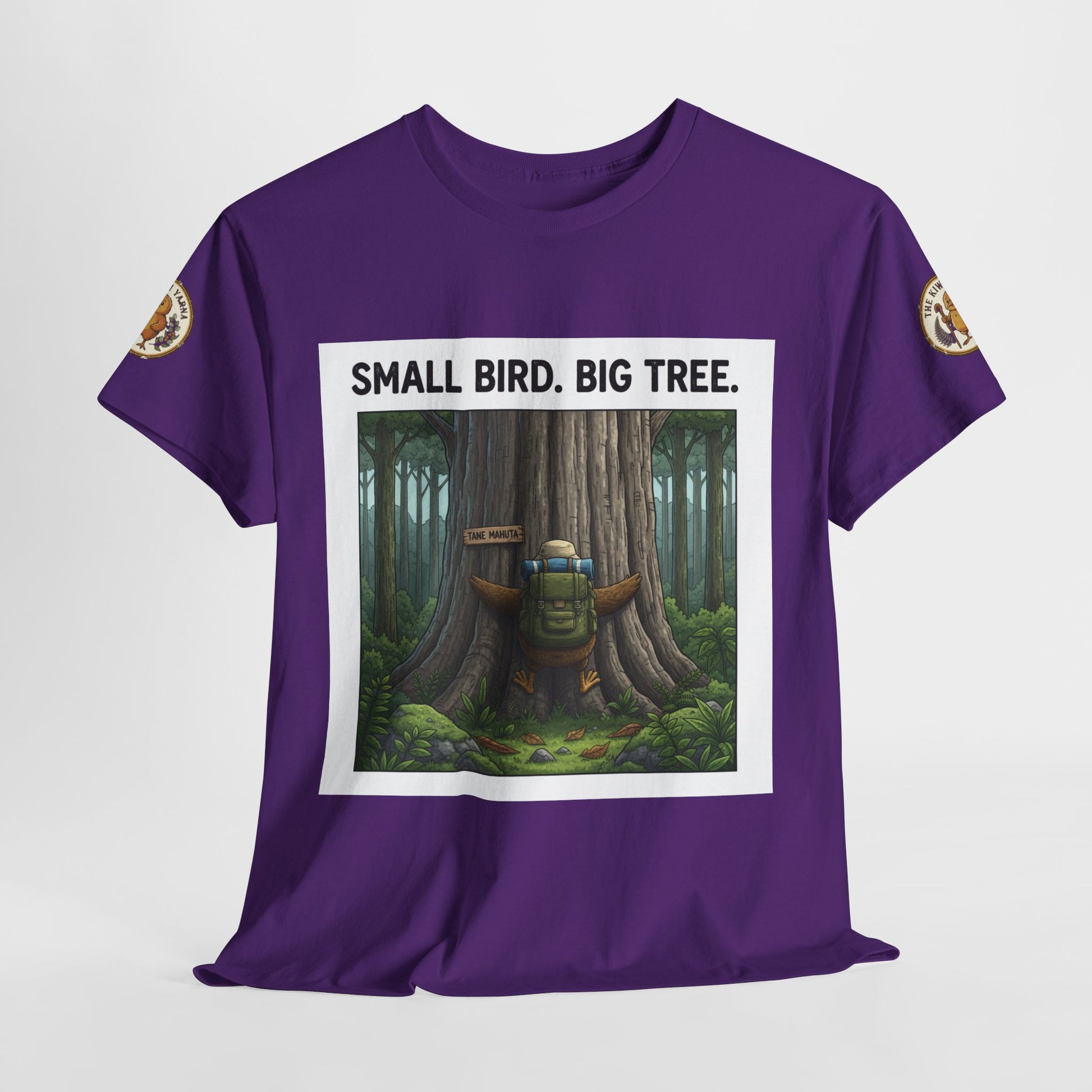 Purple graphic t-shirt front with tree scene and 'Small Bird. Big Tree.' text