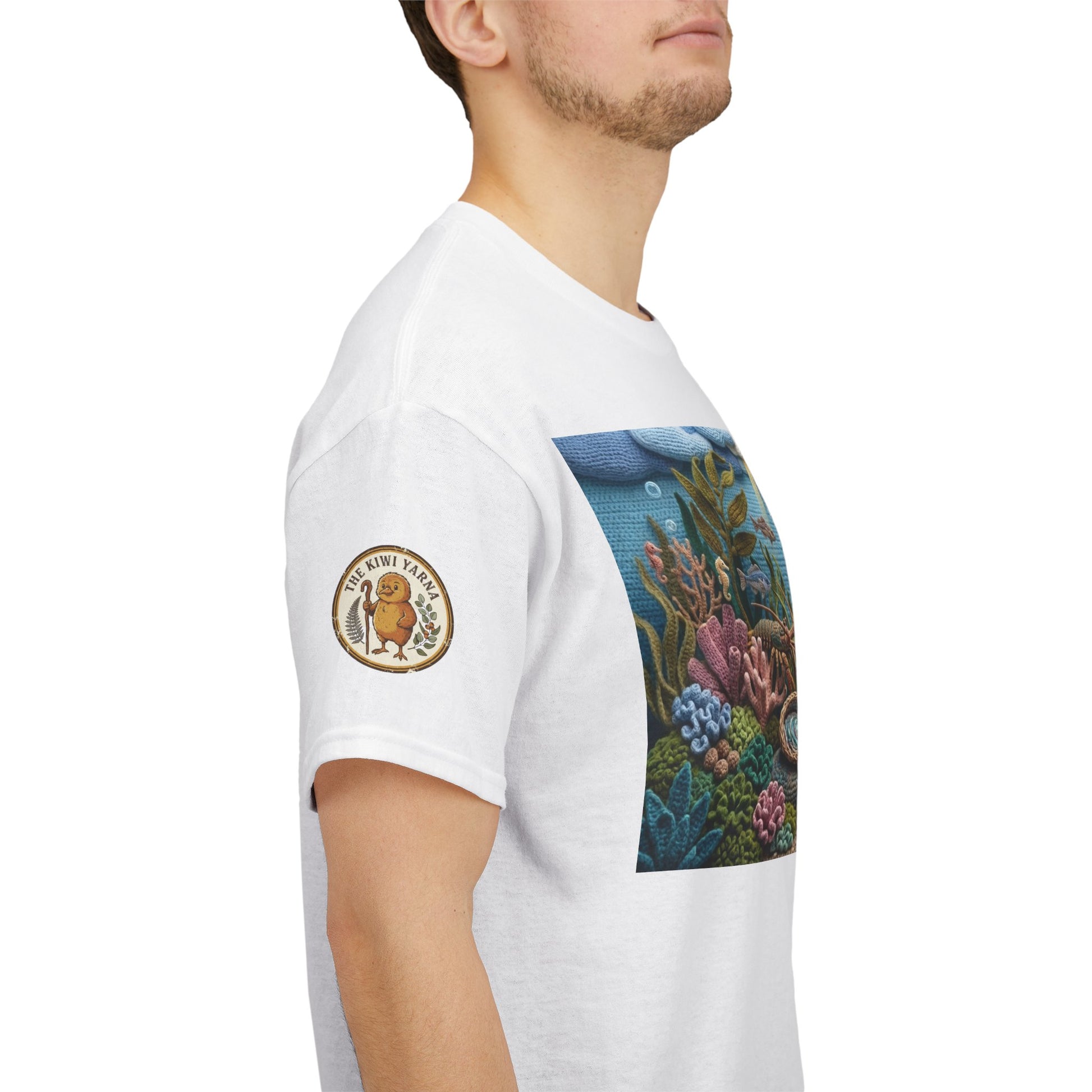 White T-shirt with front ocean scene print and circular logo patch on sleeve