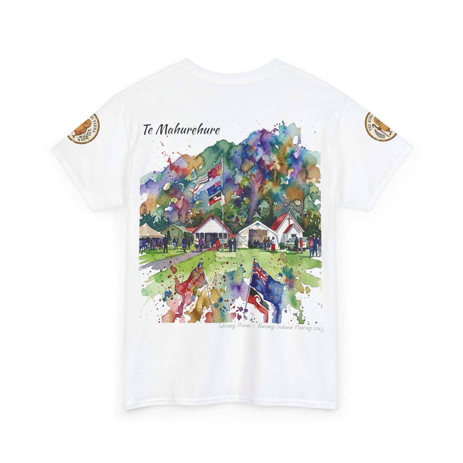 White graphic T-shirt with colorful watercolor village print and circular sleeve patches