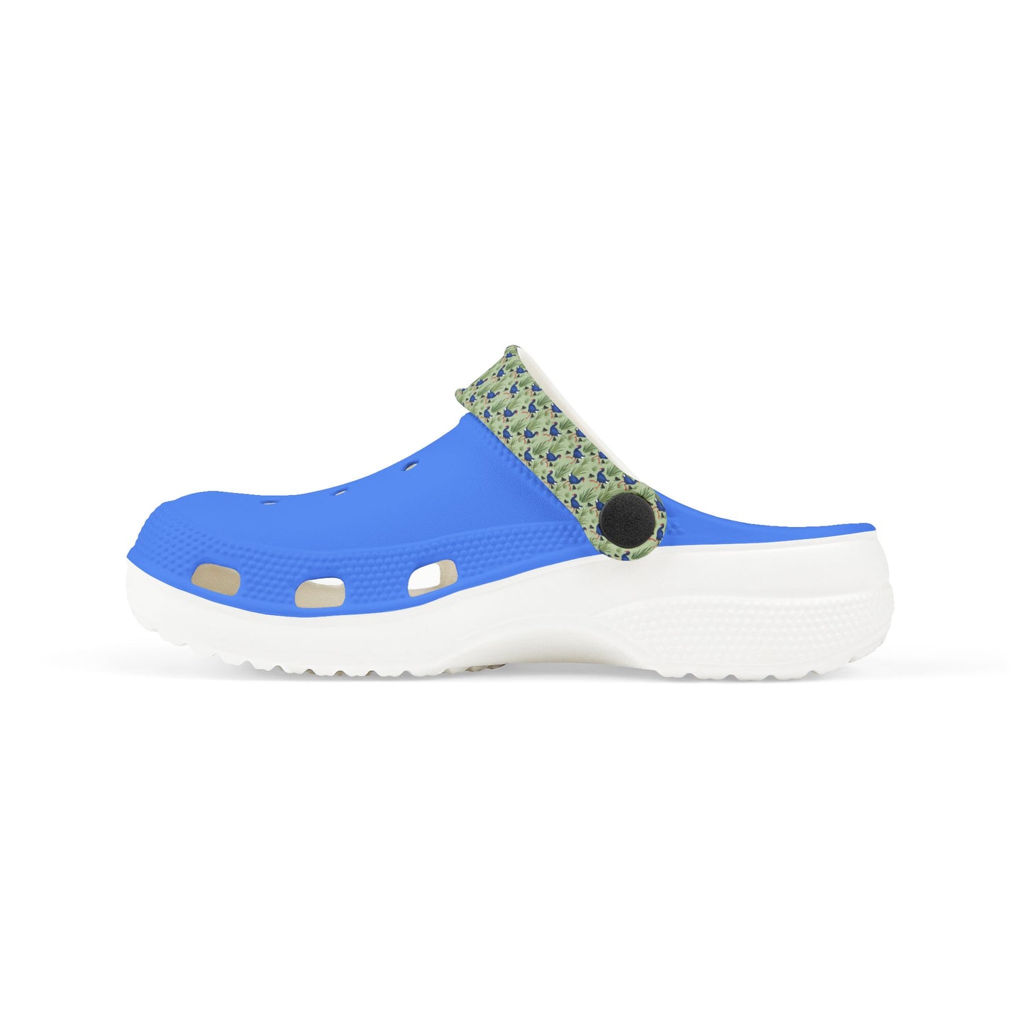 Kids clog shoes with blue top and green print side panels, white chunky sole.