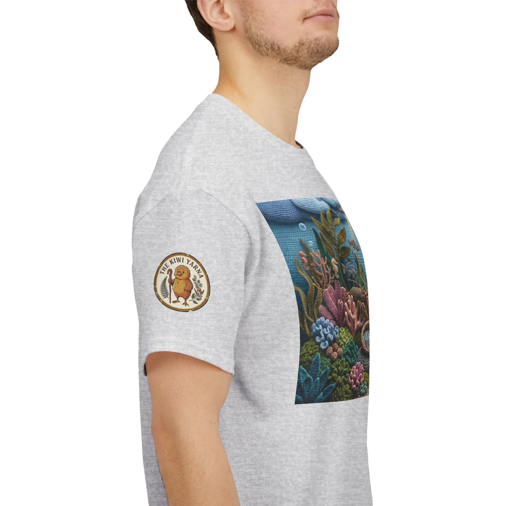 Light gray T-shirt with circular sleeve logo patch and rectangular ocean scene front print