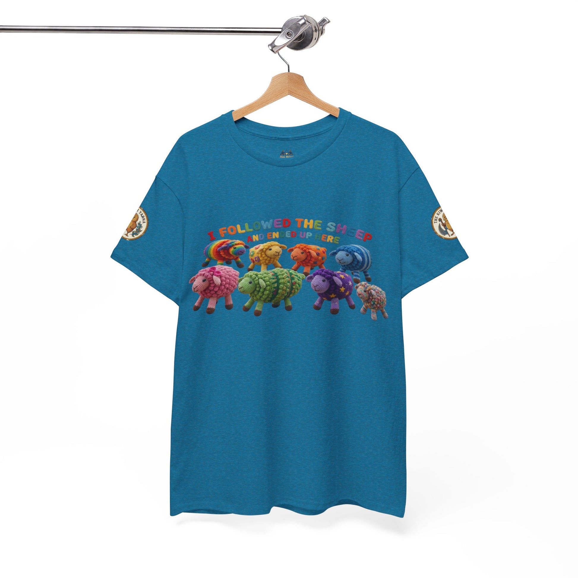 Teal crew-neck T-shirt with colorful sheep lineup and round sleeve logo patch