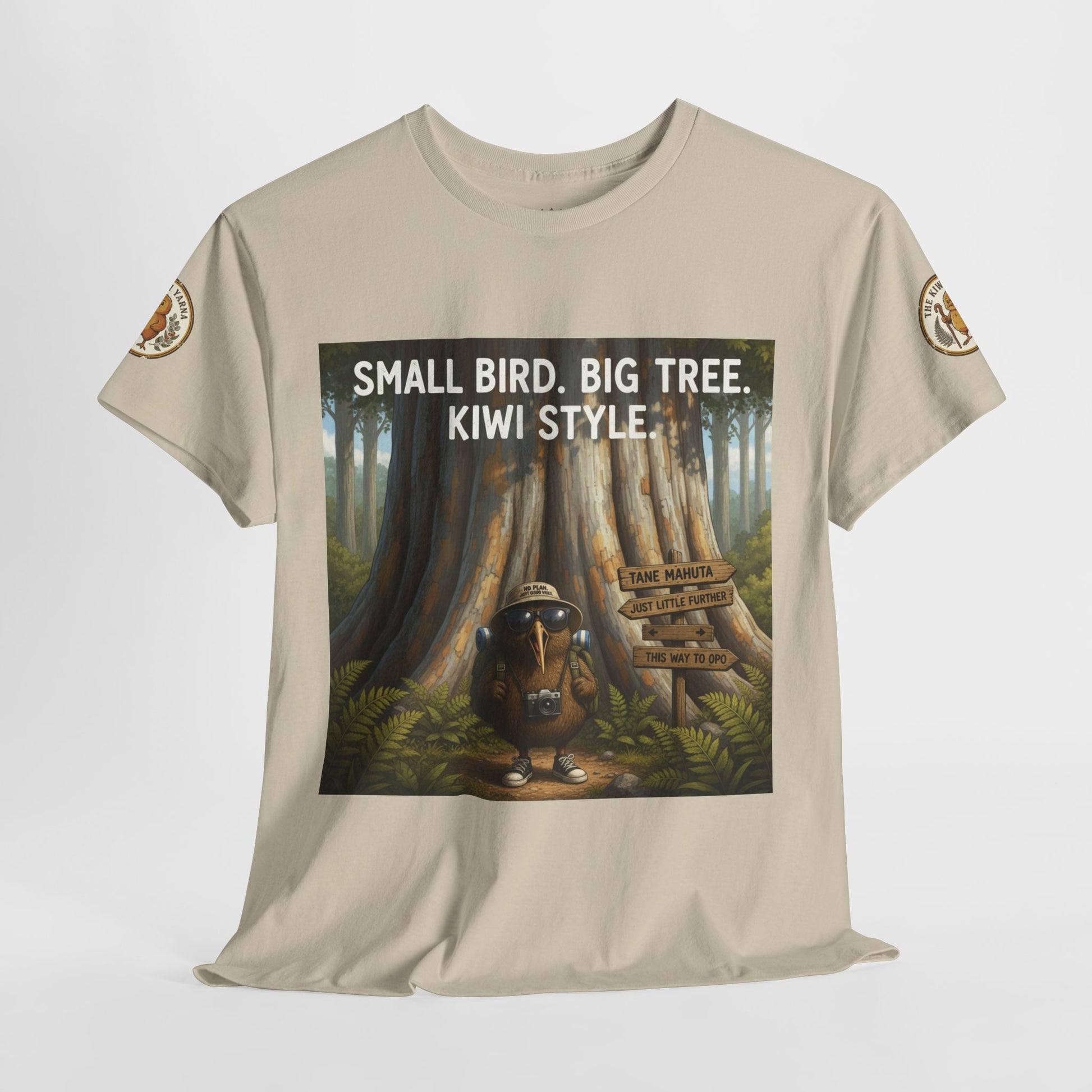 Beige short-sleeve T-shirt with centered forest scene graphic and 'Kiwi Style' text