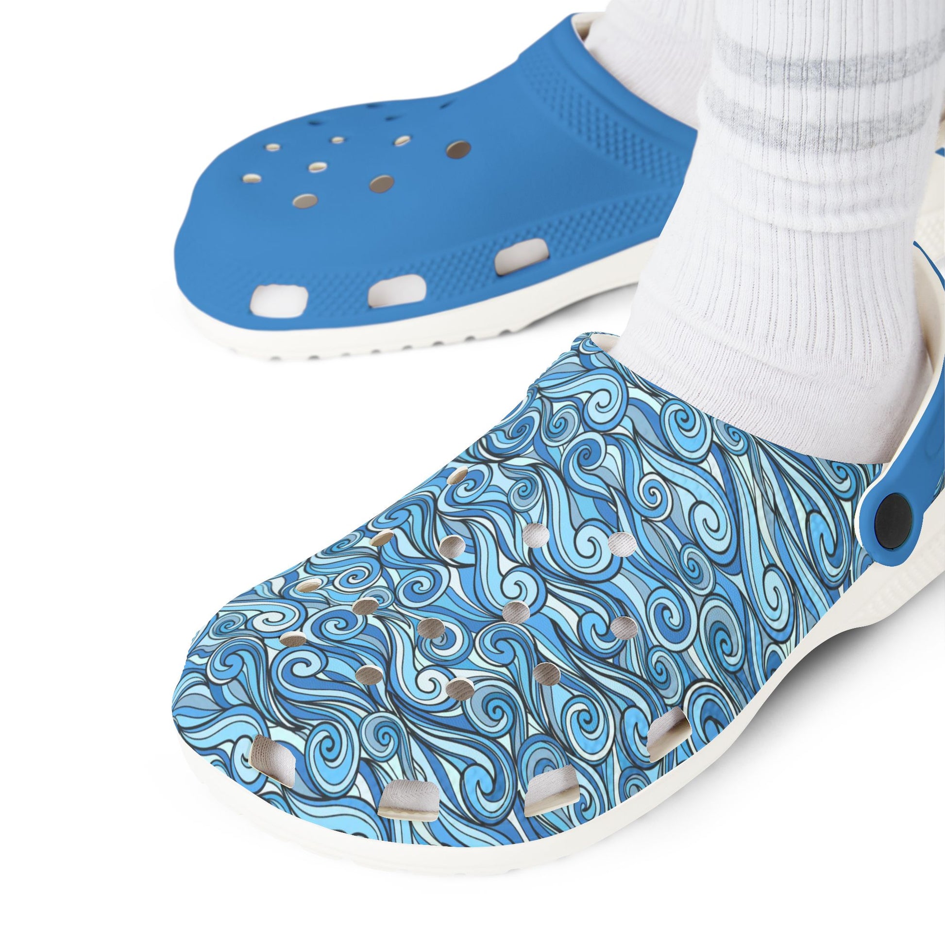 Blue and patterned slip-on clogs worn with white socks, showing front and side