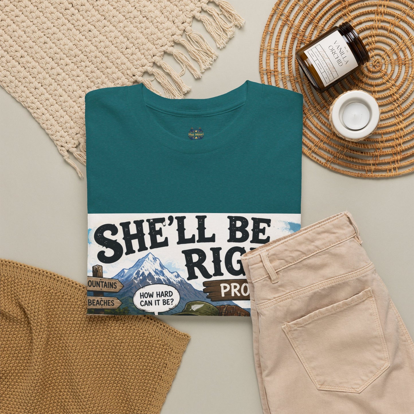 Teal graphic T-shirt laid out with front print; crew neck and chest logo visible.