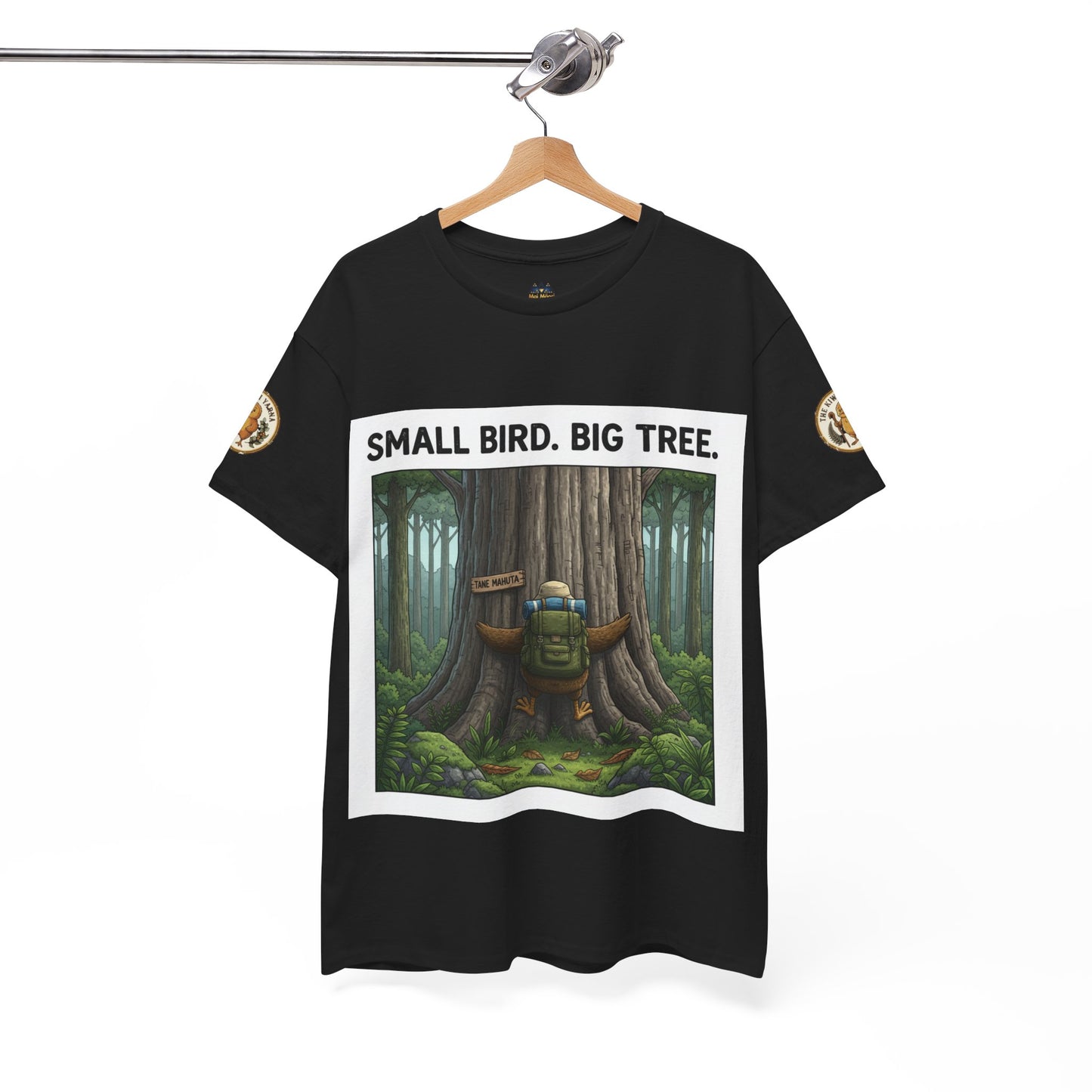 Black short-sleeve crew neck T-shirt on hanger with front forest “SMALL BIRD. BIG TREE.”