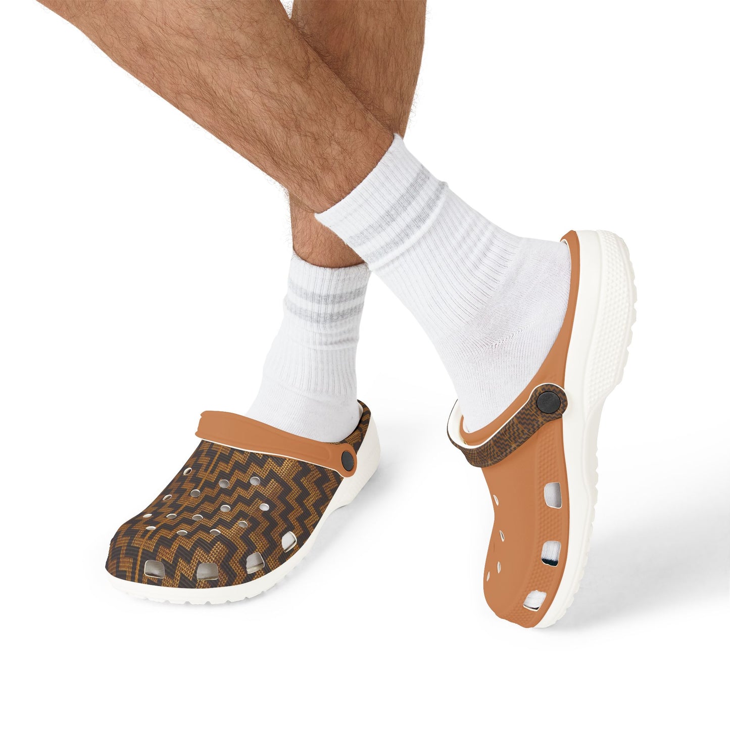 Model wearing slip-on clogs with white socks; tan clog and dark patterned clog