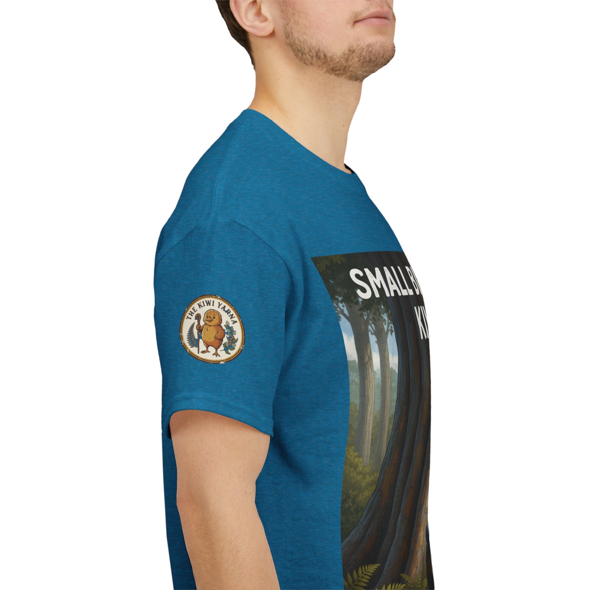 Teal graphic T-shirt worn by model with front poster print and sleeve patches