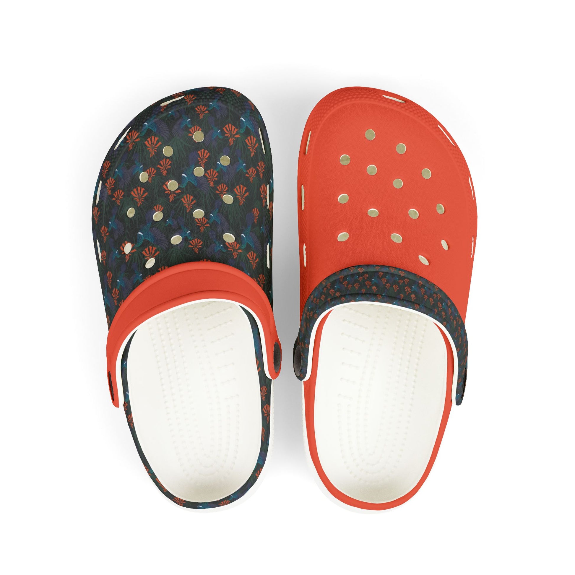 Kids slip-on clog shoes with dark floral top and orange front, vent holes, white sole