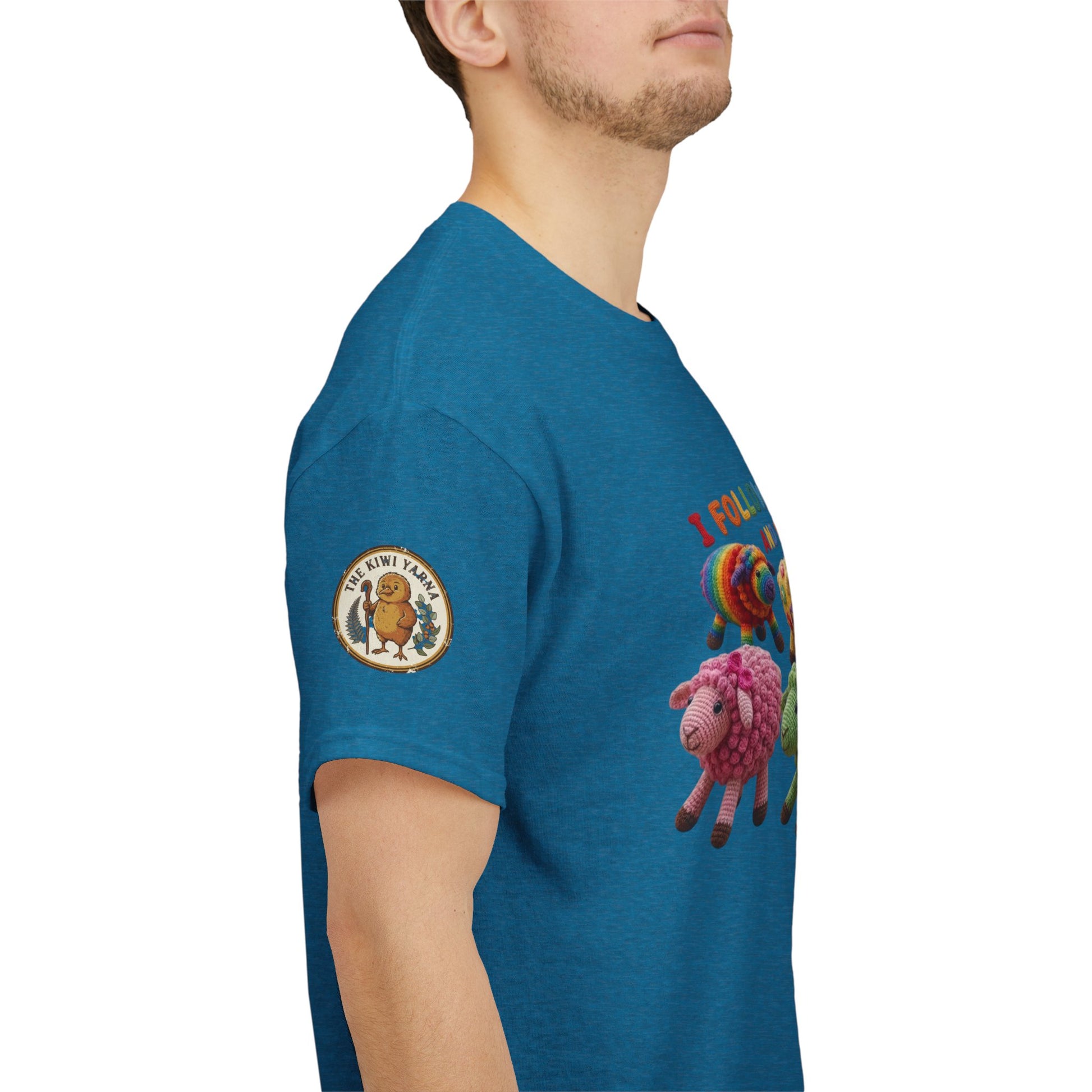 Teal crew-neck T-shirt with round emblem patch on sleeve and sheep graphic