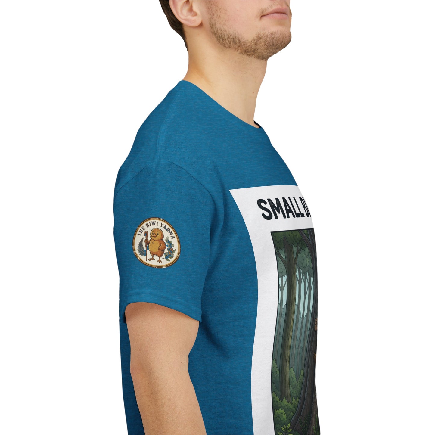 Teal short-sleeve T-shirt with circular sleeve logo and forest graphic panel