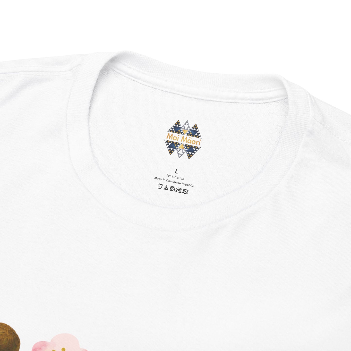 White T-shirt neckline close-up with small multicolor Kiwiana logo on chest