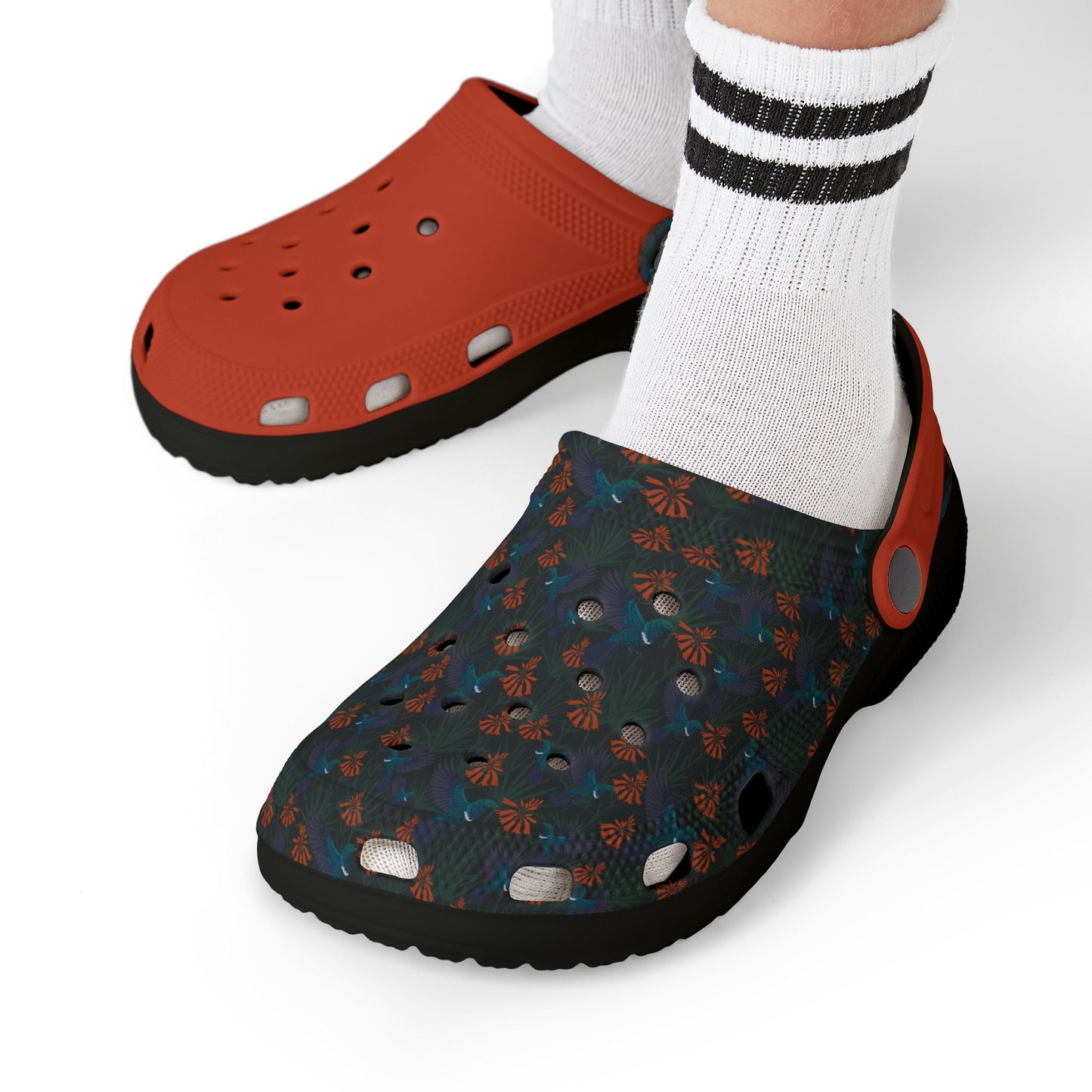Kids' clog-style casual shoes on model feet: orange pair with dark blue patterned pair