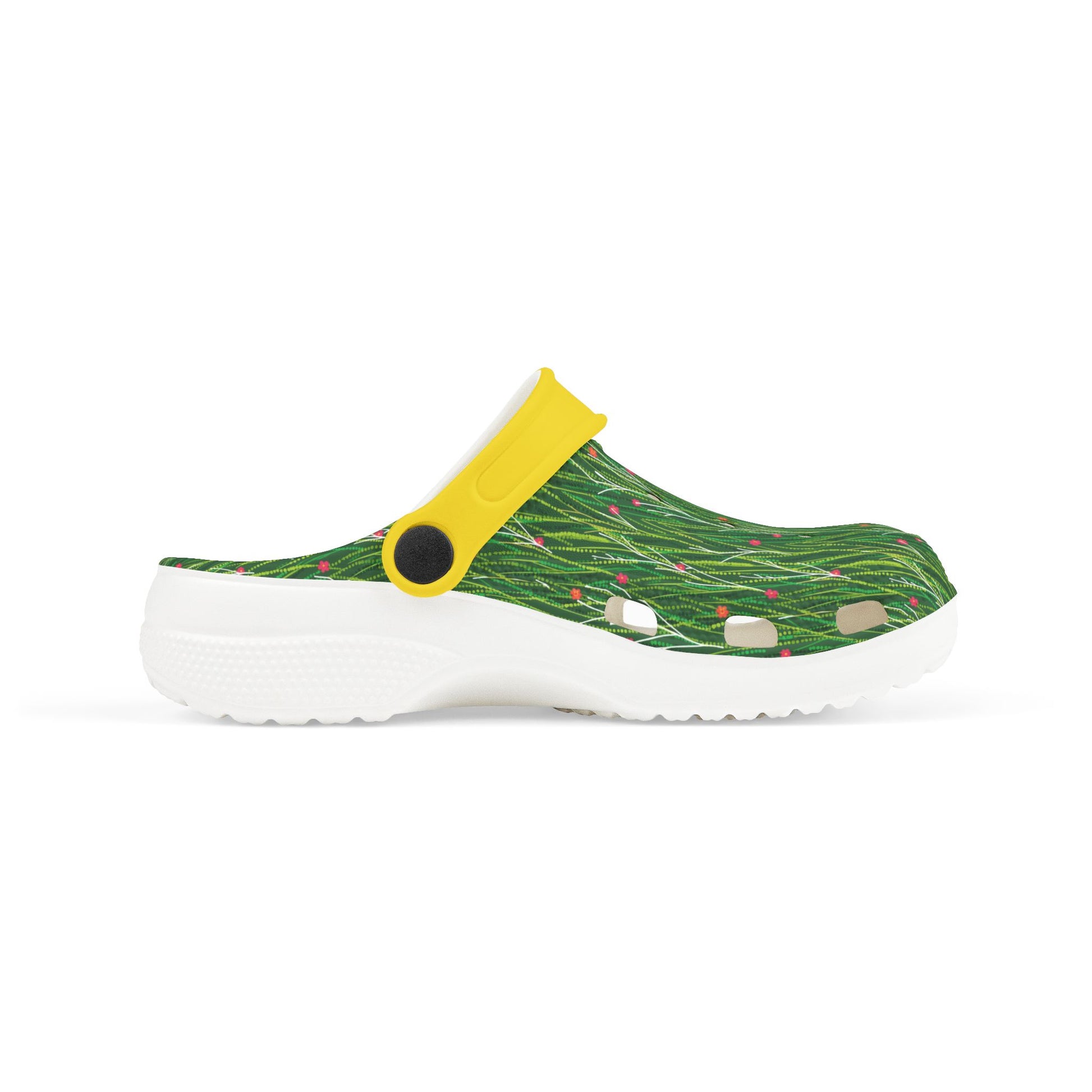 Green patterned slip-on clog with yellow strap and white sole, side view