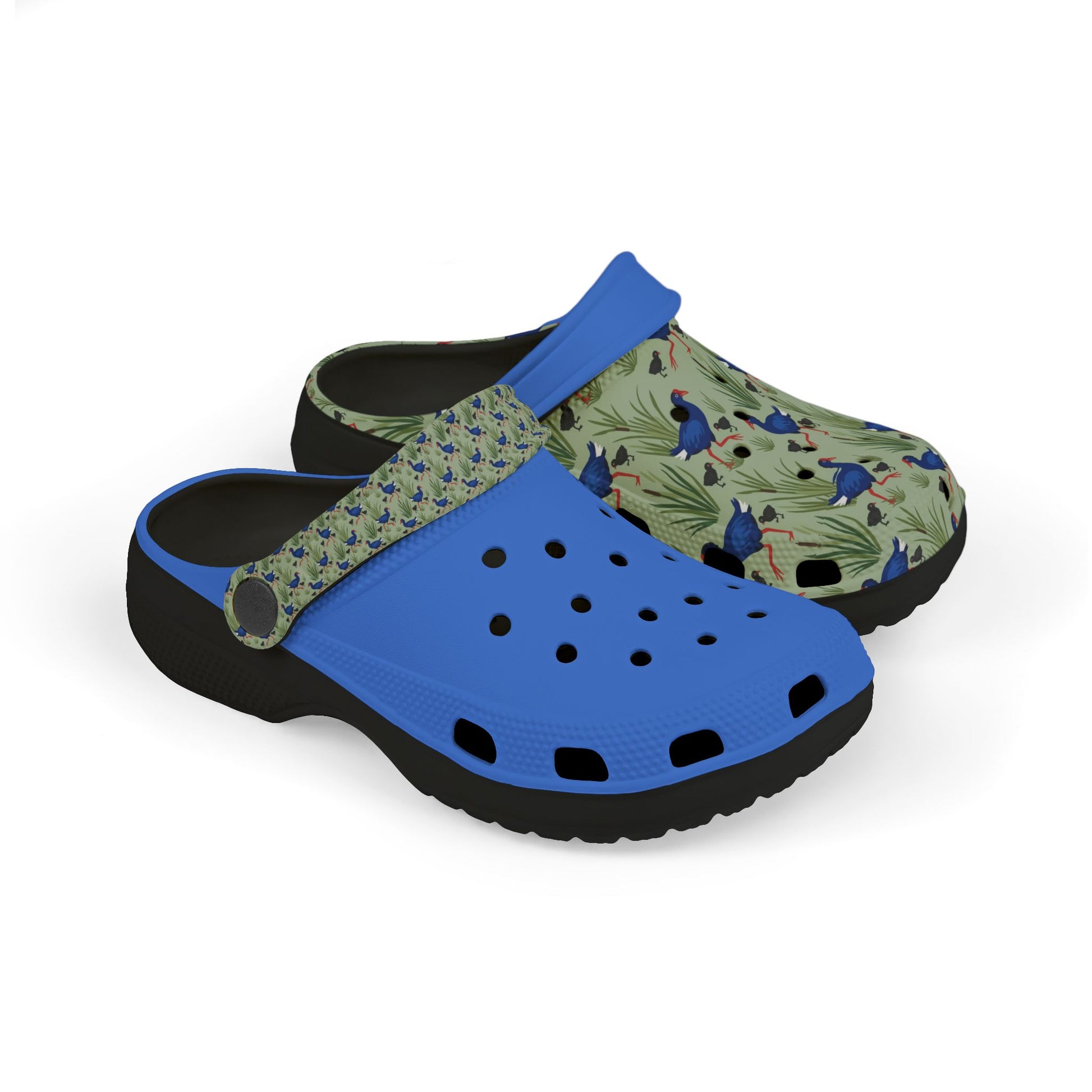 Kids slip-on clogs with blue base, patterned upper, and perforated toe.