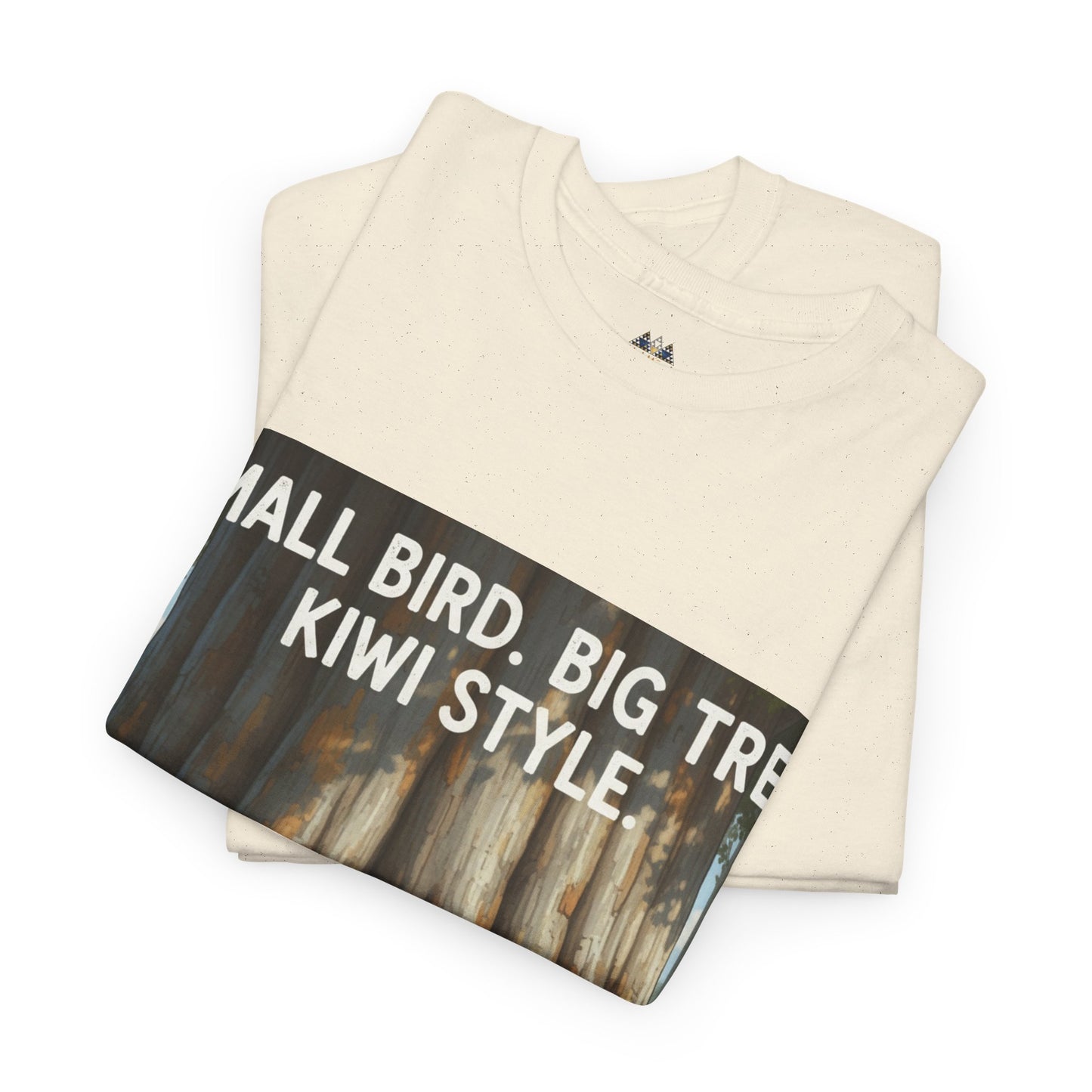 Cream crewneck T-shirt folded with large front forest graphic and white text