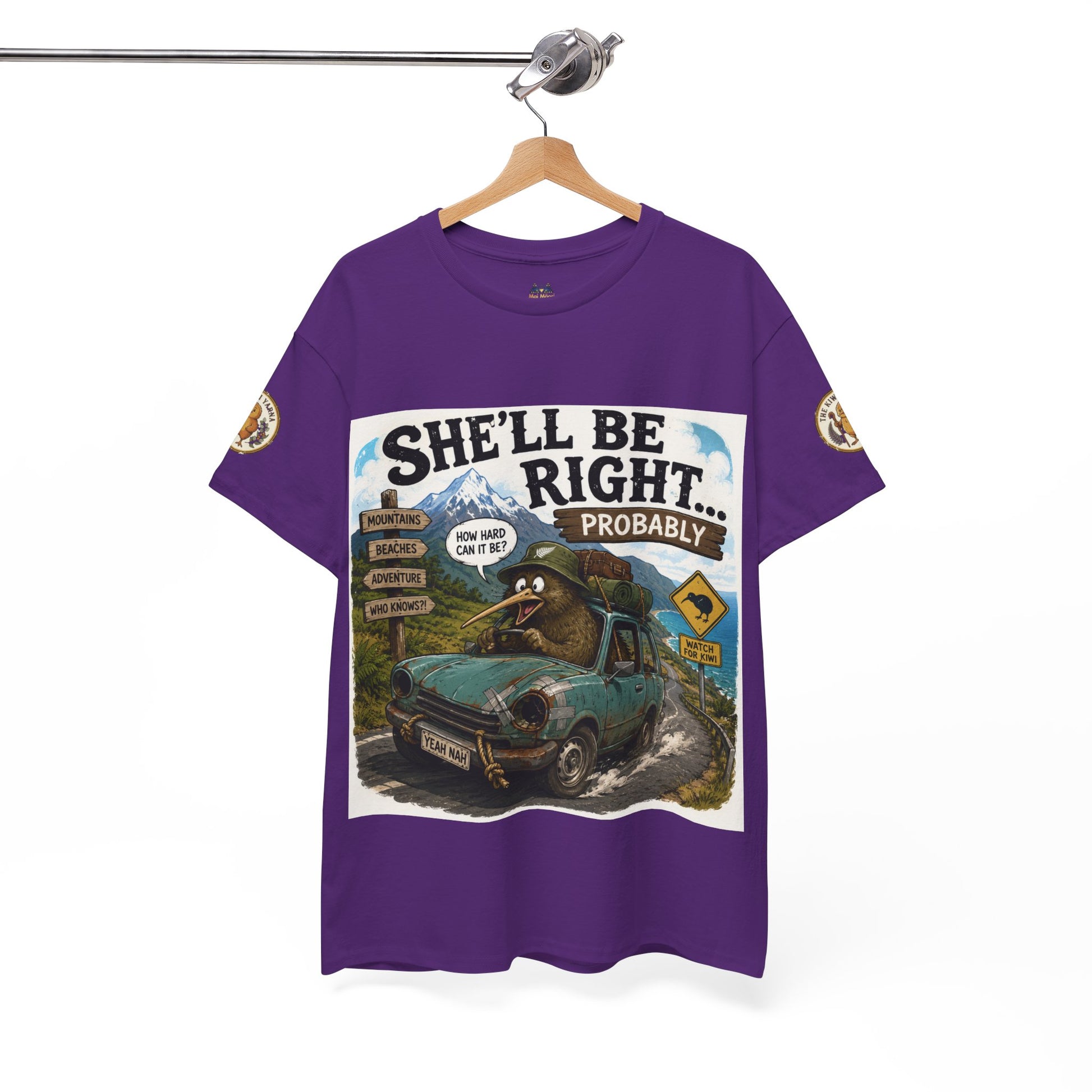 Purple graphic T-shirt hanging, front square van-scene print with adventure badges