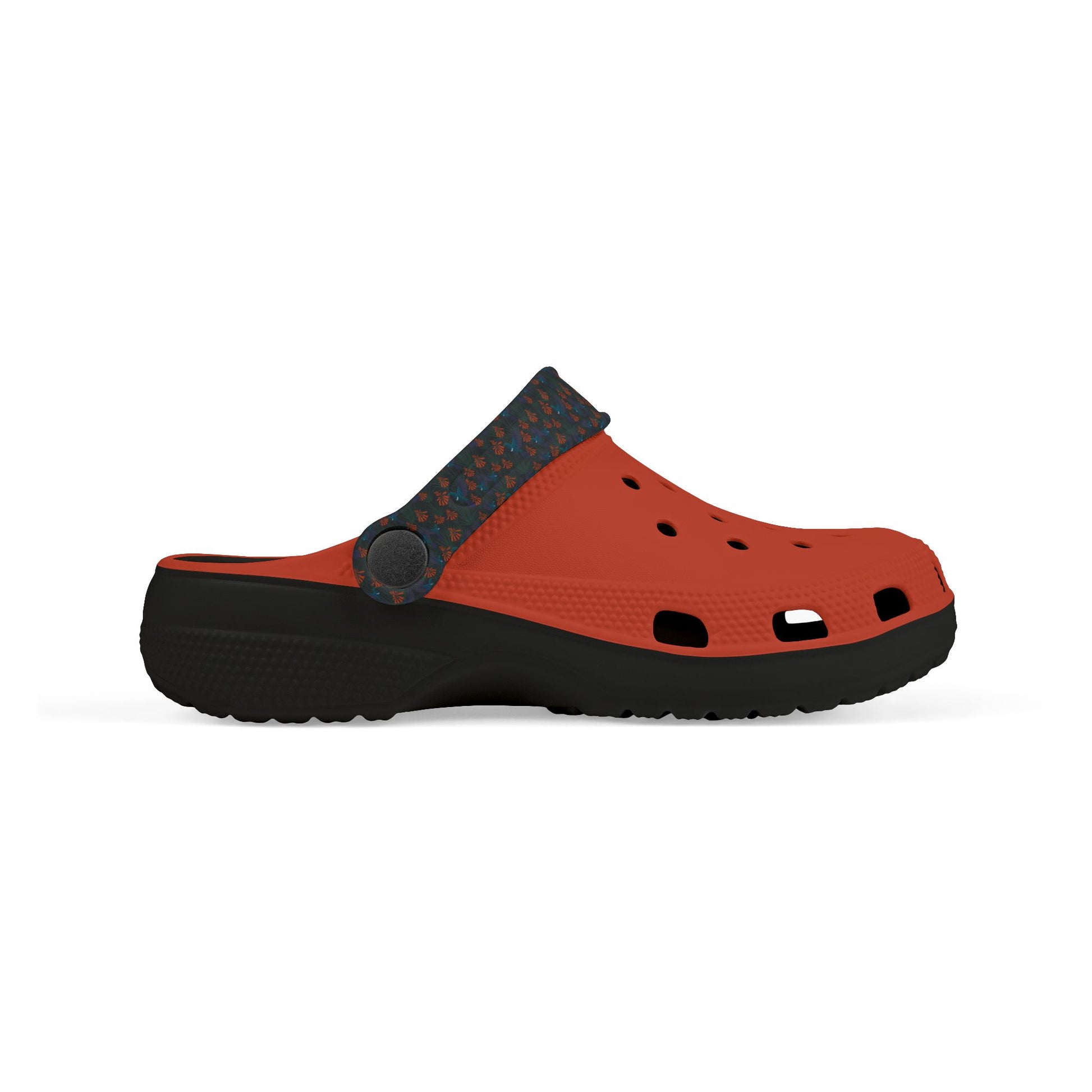 Kids' clog-style casual shoe, front side view, orange upper with dark blue patterned panel