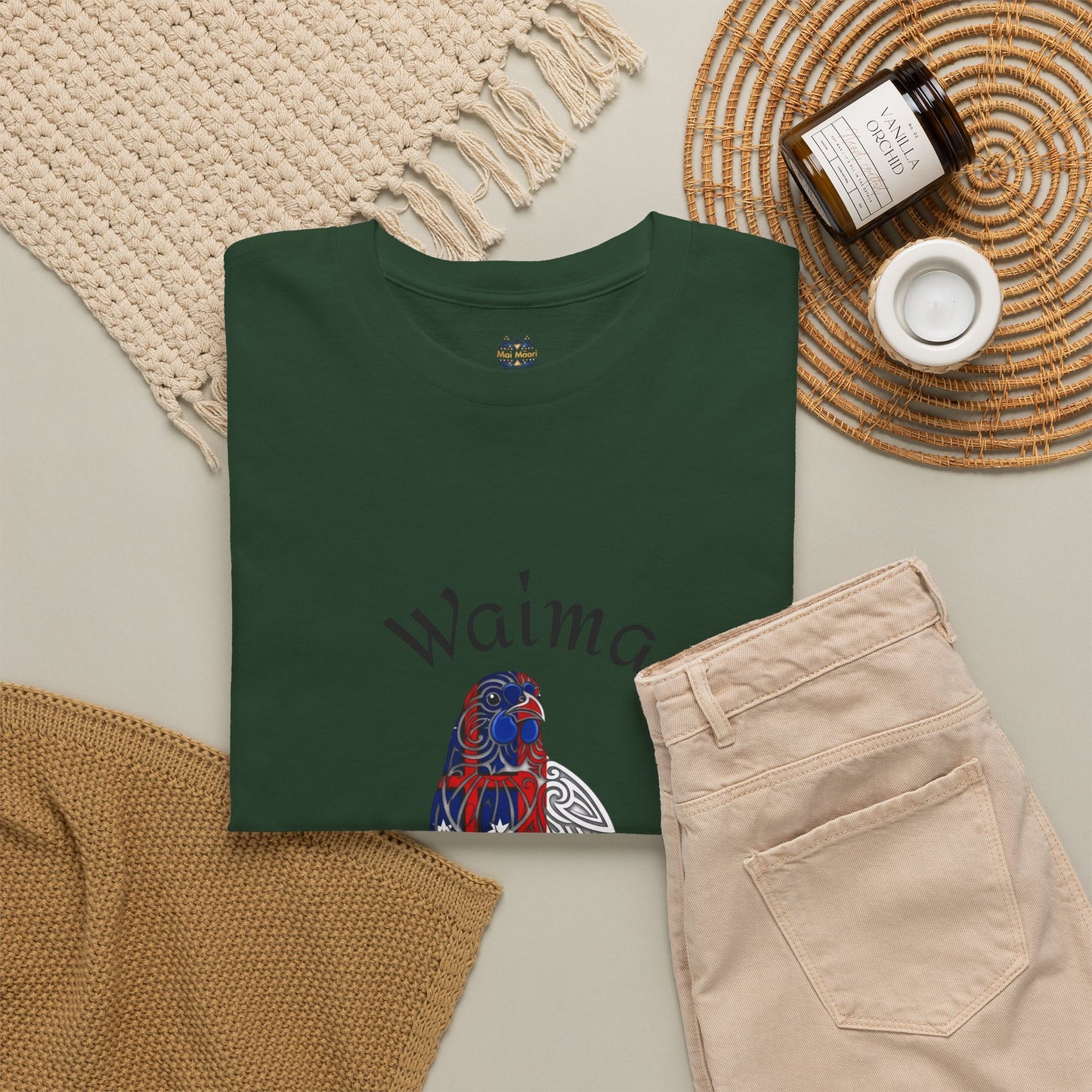 Dark green T-shirt flat lay with bird graphic, rounded neckline, short sleeves