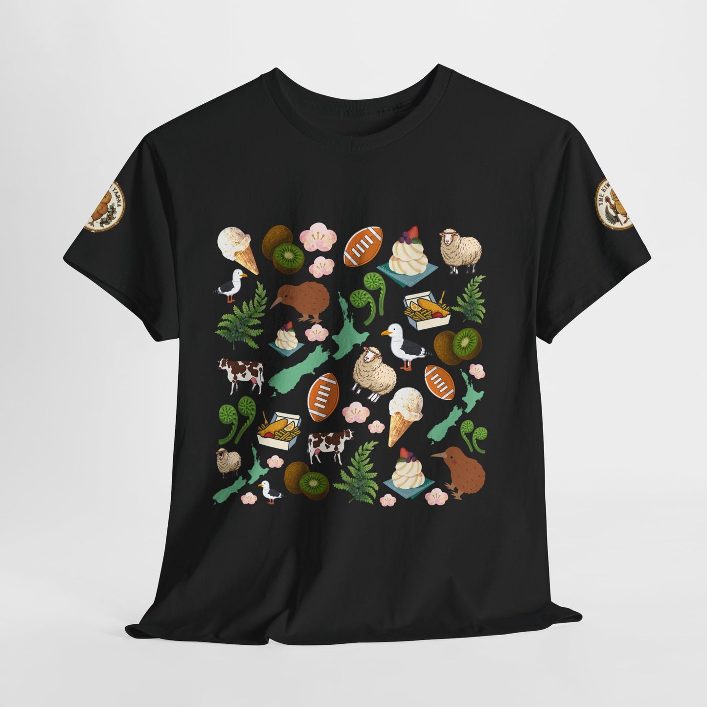 Kiwiana graphic T-shirt in black with colorful wildlife, fruit, and fern illustrations on front
