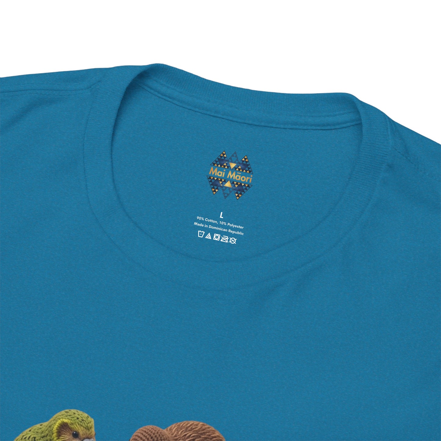 Blue T-shirt close-up: crew neck label above colorful bird and pizza graphic