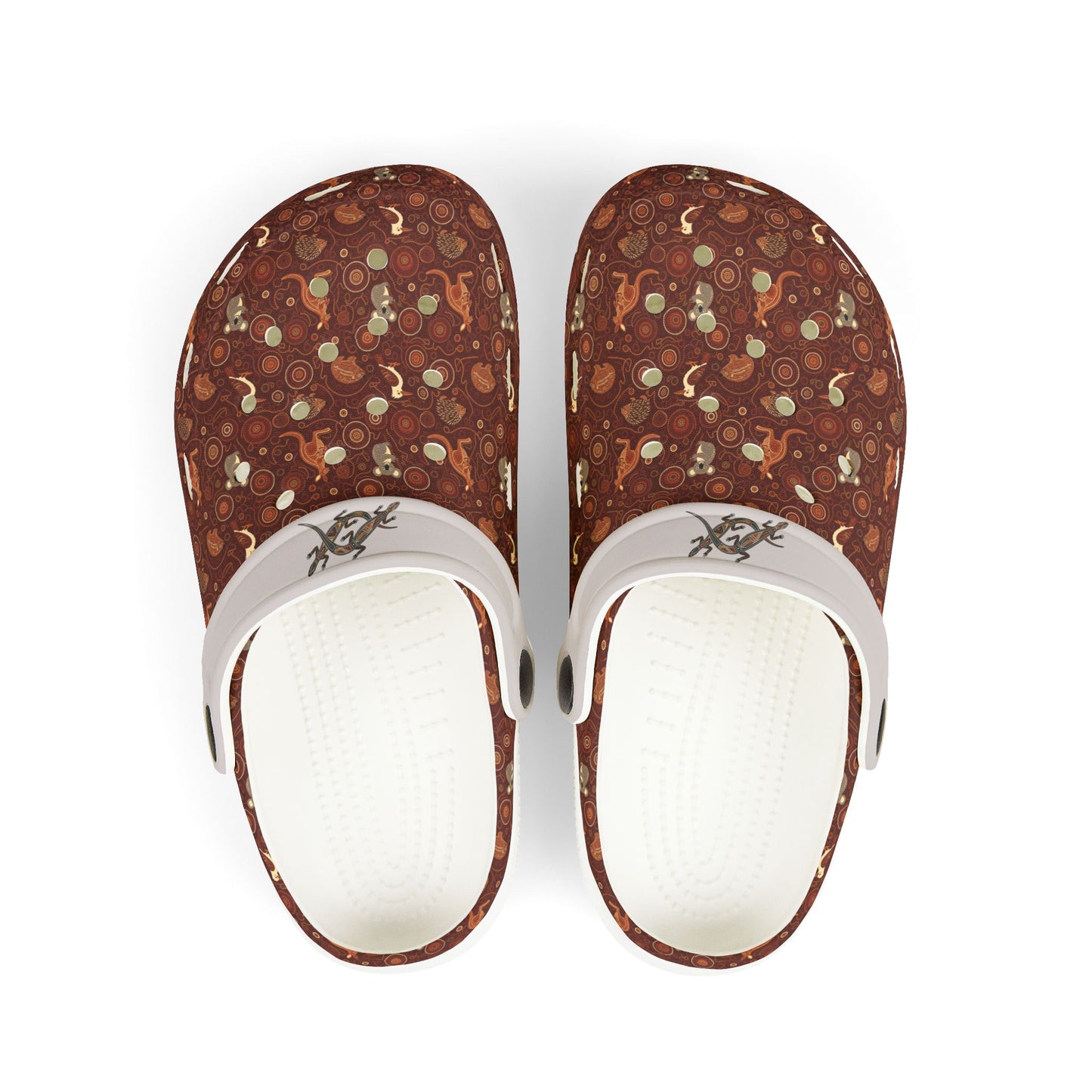 Printed casual clog shoes with white straps and open vents on maroon-brown fabric.