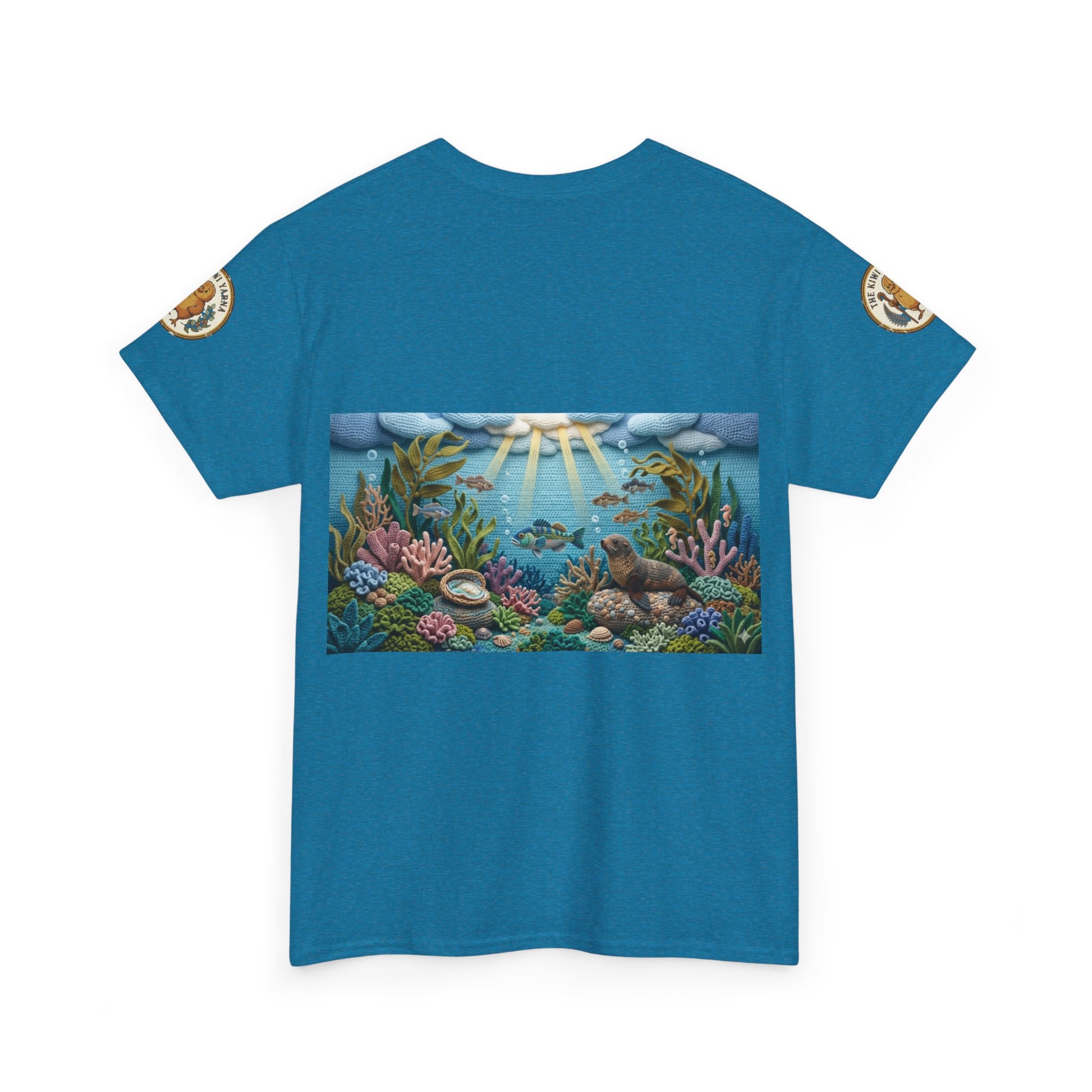 Teal/blue ocean graphic T-shirt front with reef artwork and small round sleeve patches