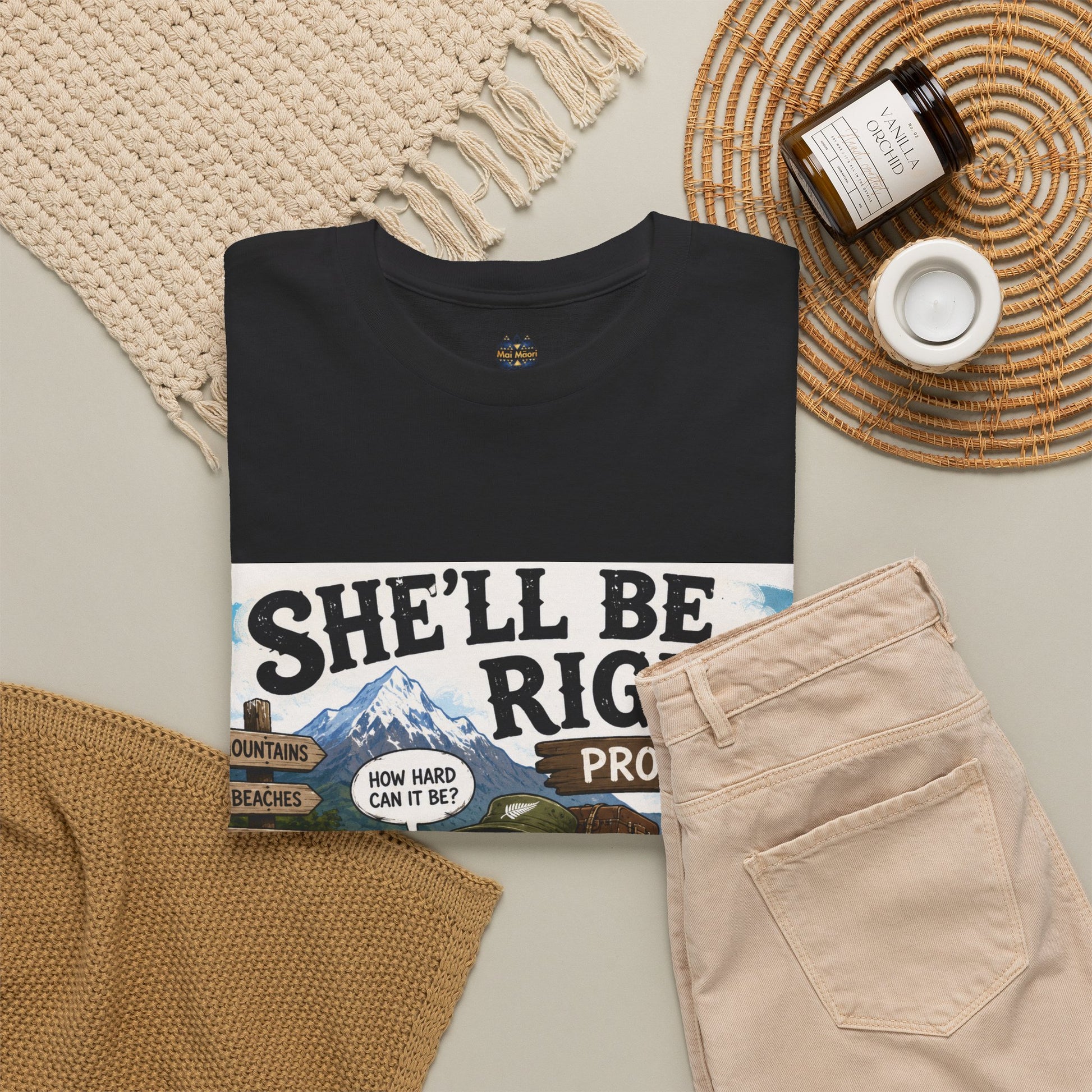 Black T-shirt with large “She’ll Be Right” style graphic across chest