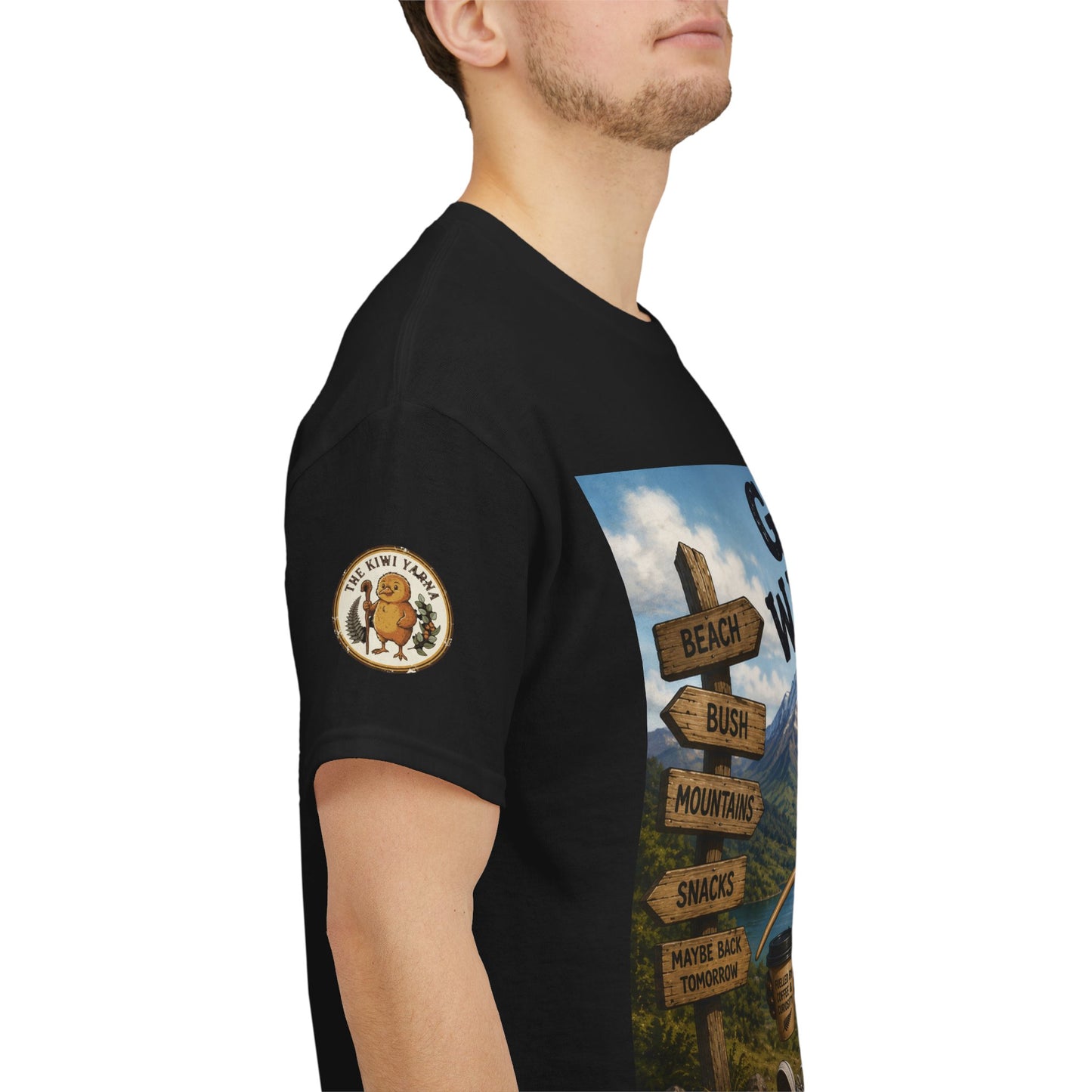 Black T-shirt with Kiwi logo patch on sleeve and vertical adventure graphic on chest.