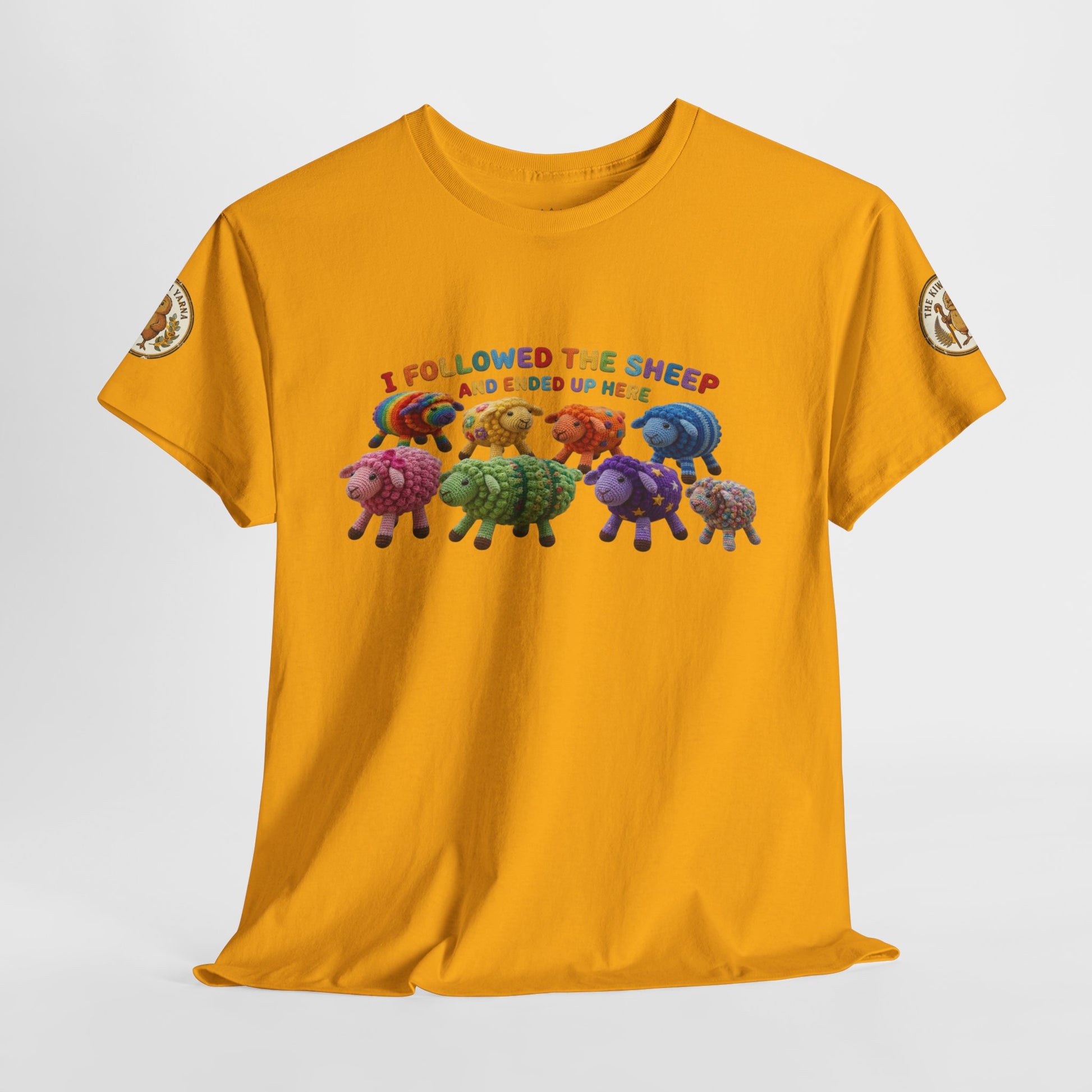 Mustard yellow front view T-shirt with colorful sheep herd graphic and “I followed…” text.
