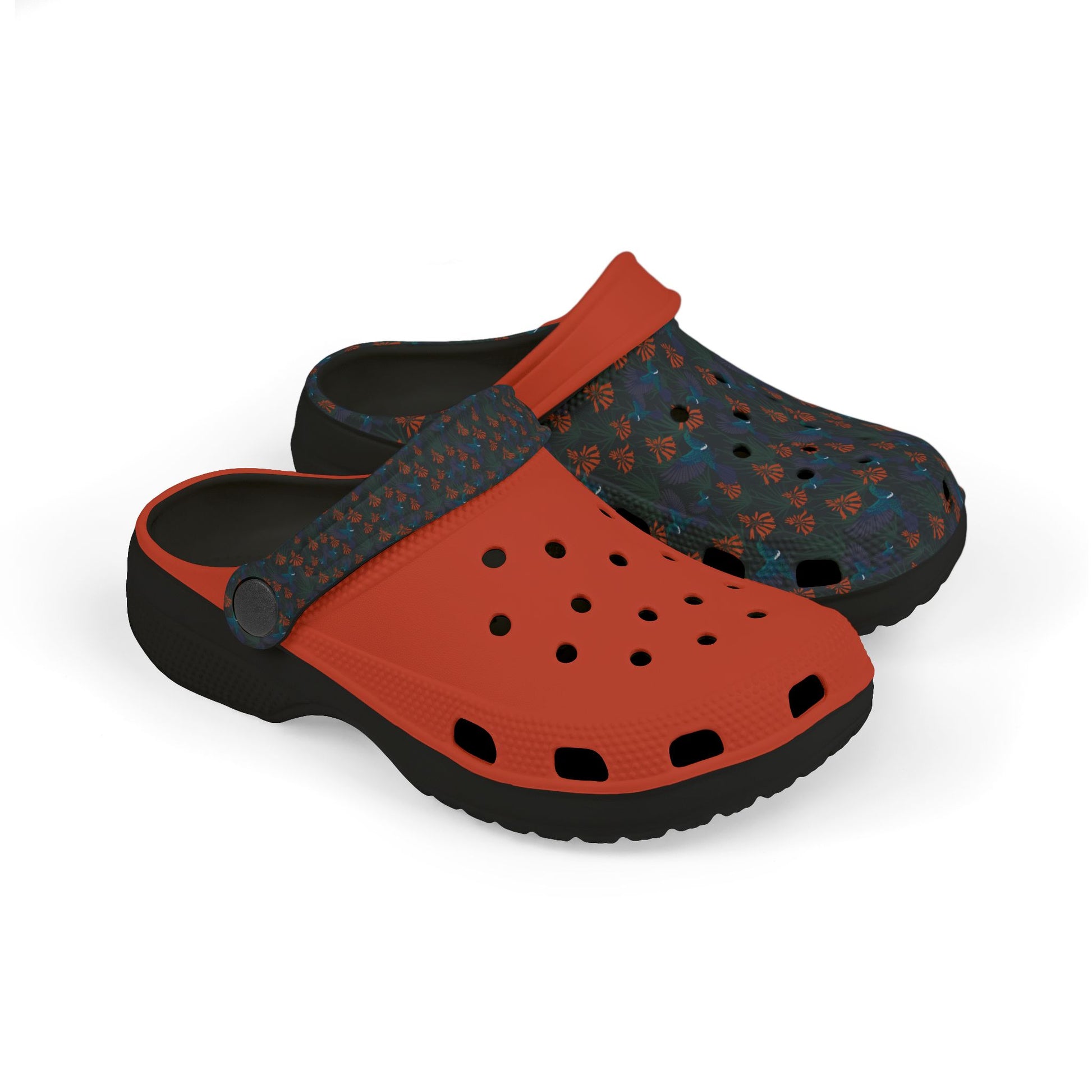 Kids' clog-style casual shoes in orange with dark blue patterned top and ventilation holes