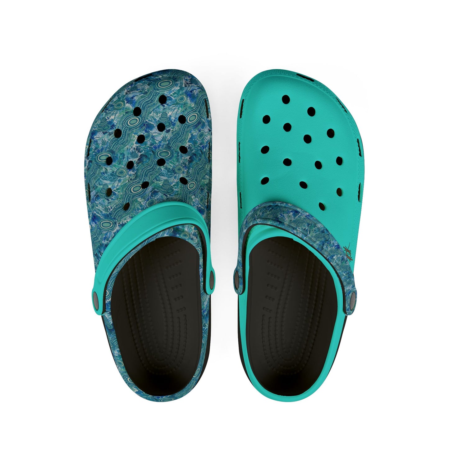 Pair of teal and blue patterned clog shoes with perforations and black interior