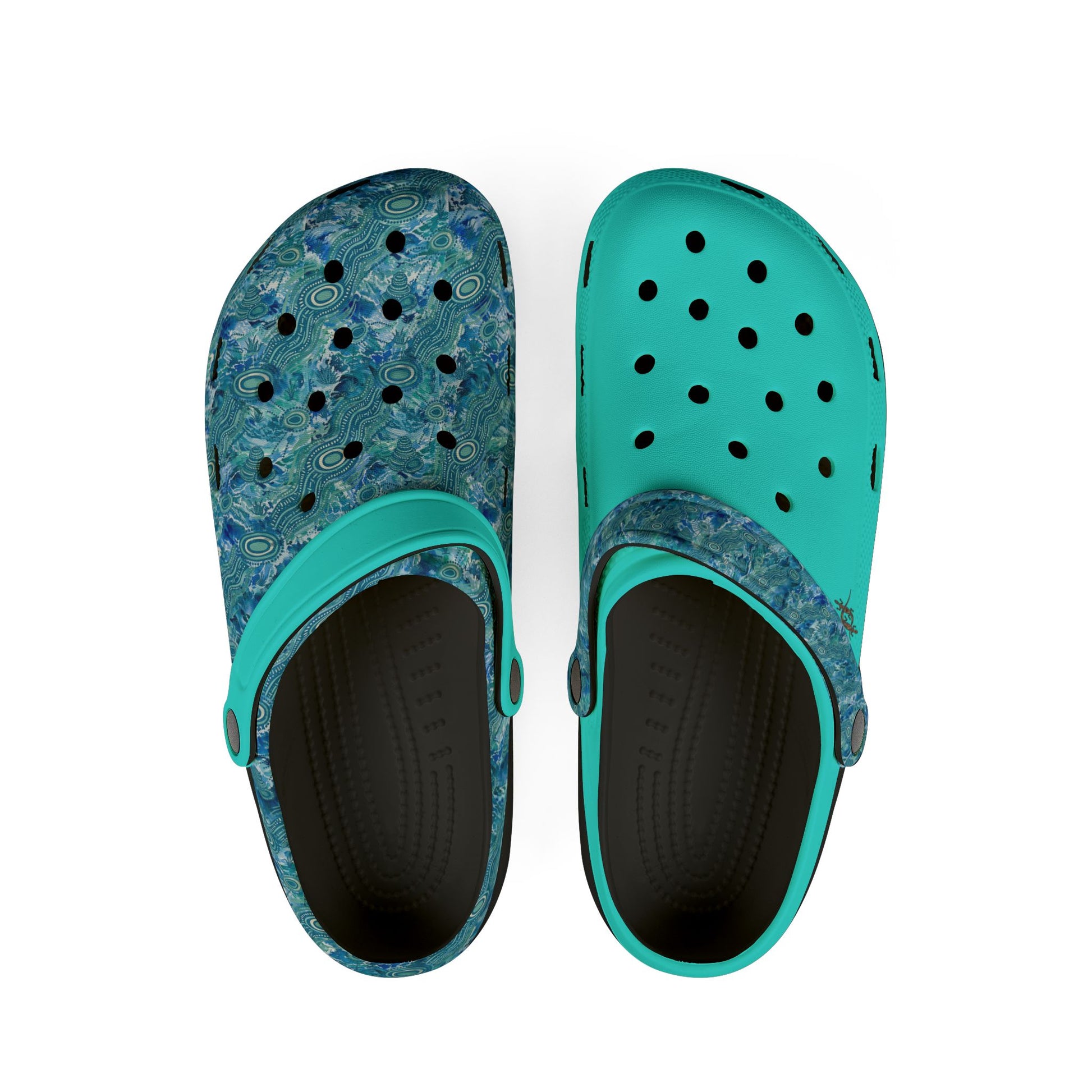 Pair of teal and blue patterned clog shoes with perforations and black interior