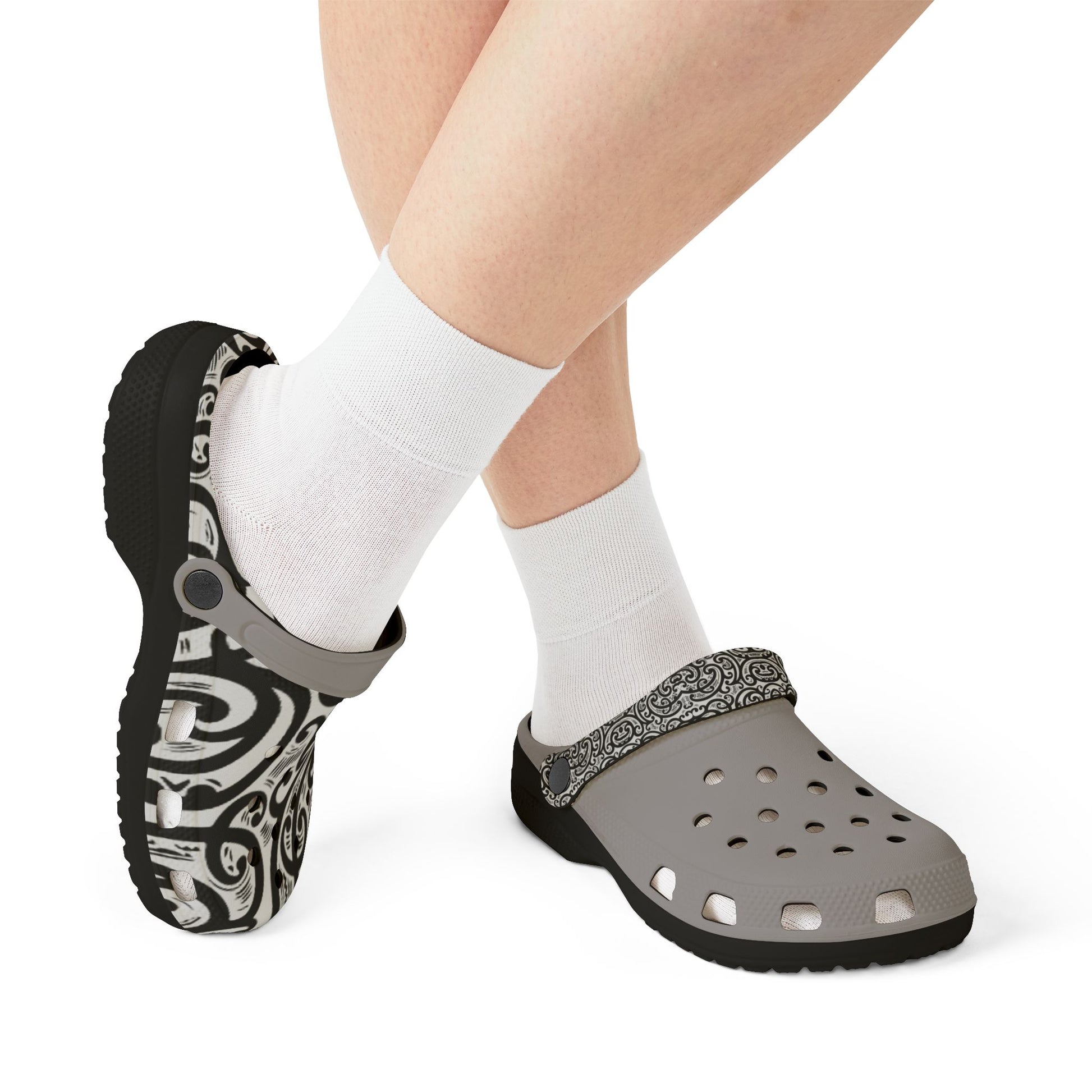 Croc-style clogs with black-and-white patterned back and light gray perforated footbed