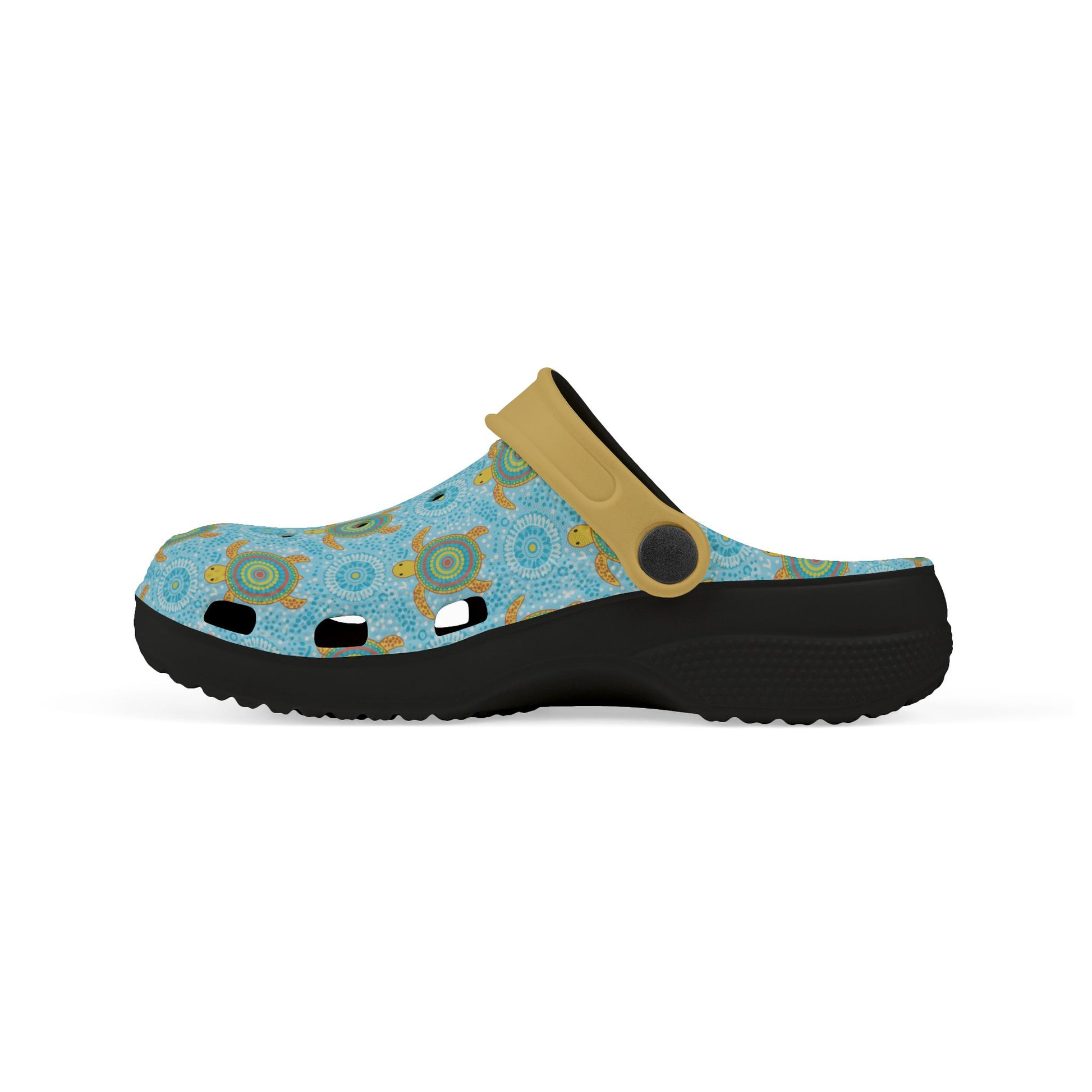 Three-quarter view blue patterned clogs with tan strap and chunky black sole