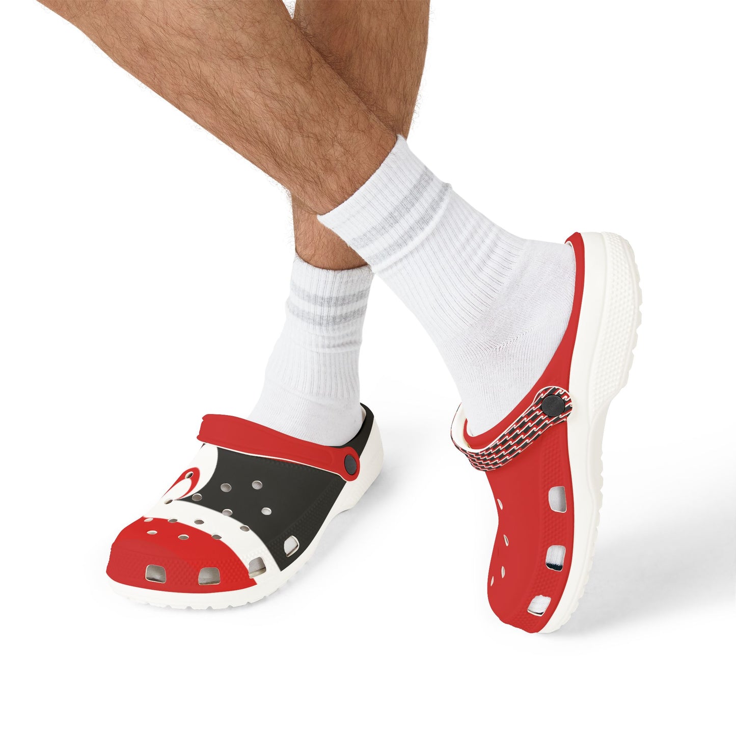 Tino clogs on feet with white socks, red upper and black side panel, perforations