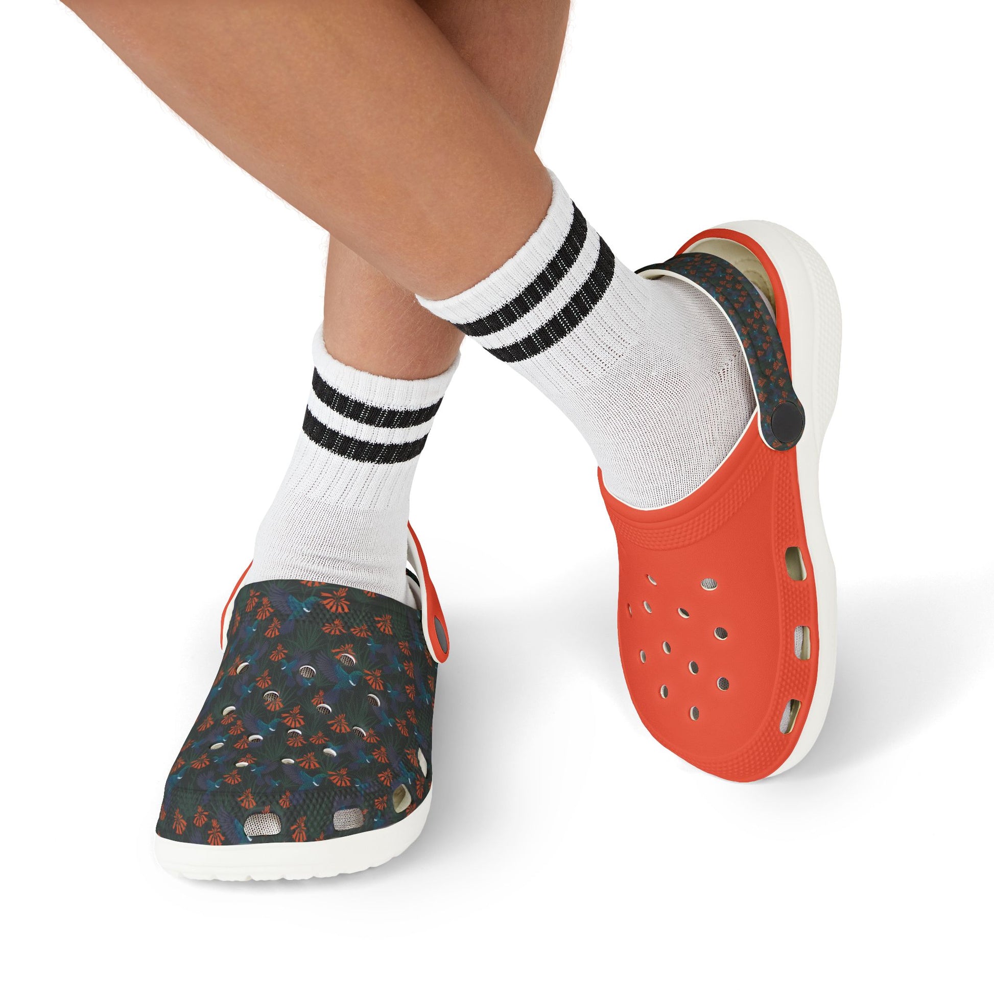Kids clogs with socks, orange upper and dark floral print, slip-on style, white sole