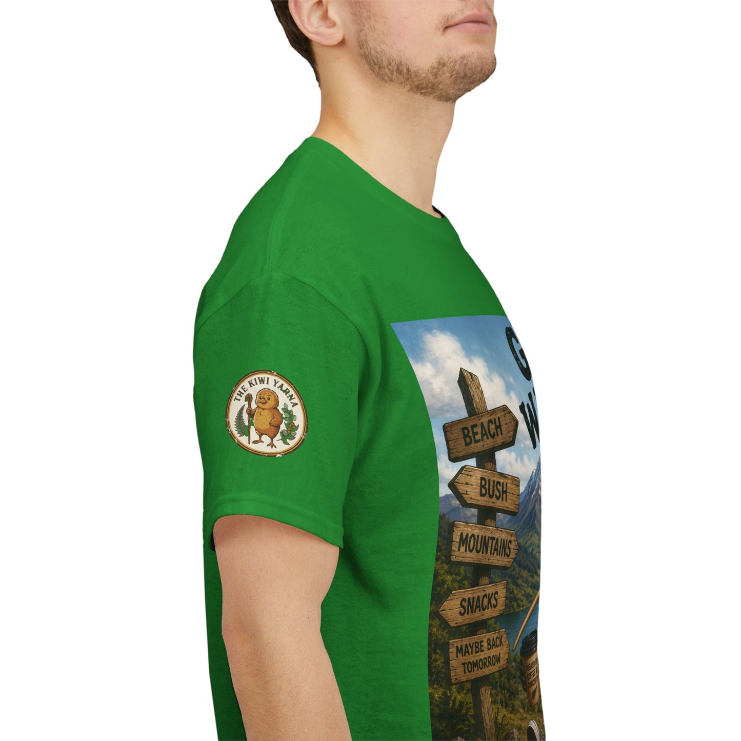 Green T-shirt side view with circular sleeve patch and adventure graphic panel