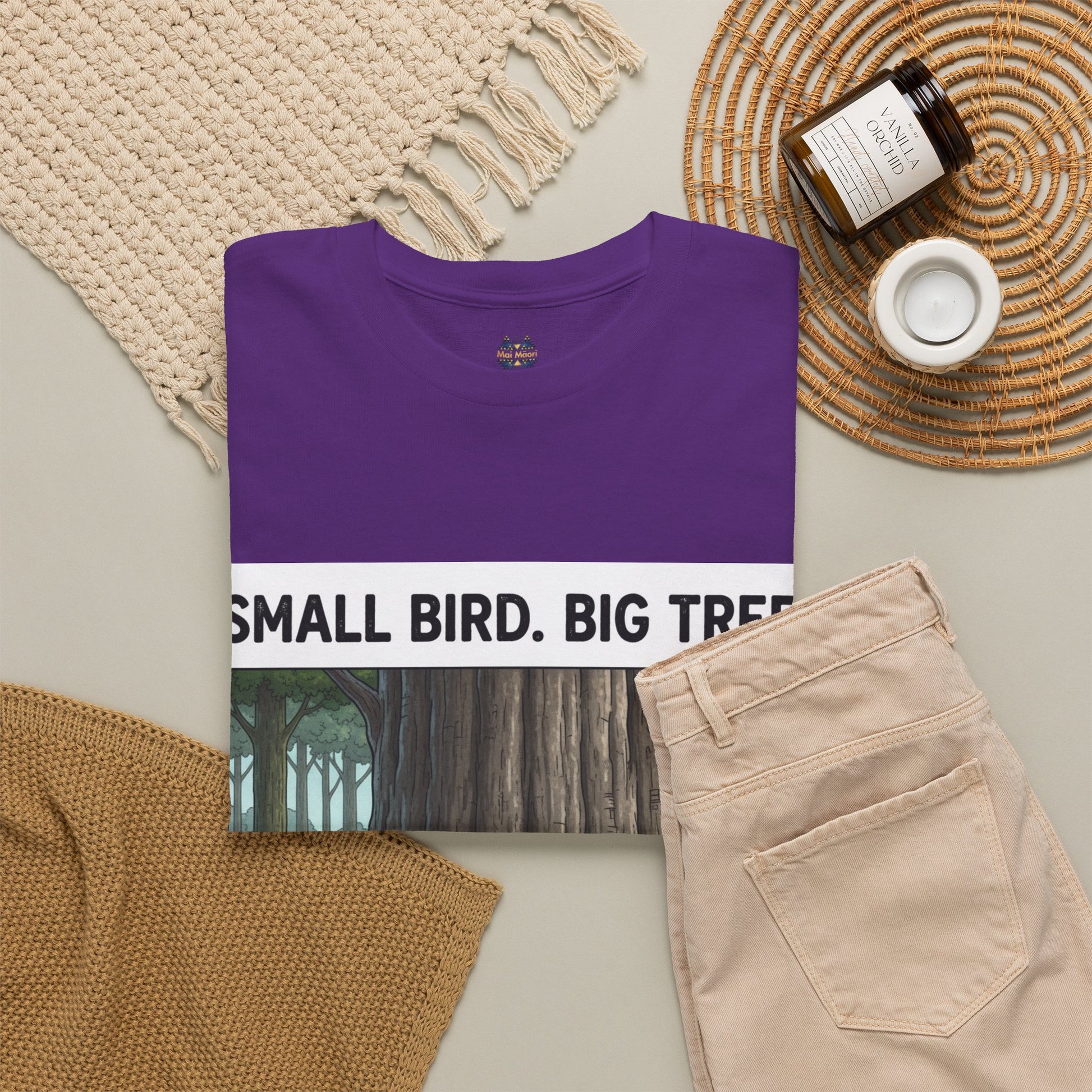 Purple crew-neck T-shirt on display, showing partial “Small Bird. Big Tree.” front print