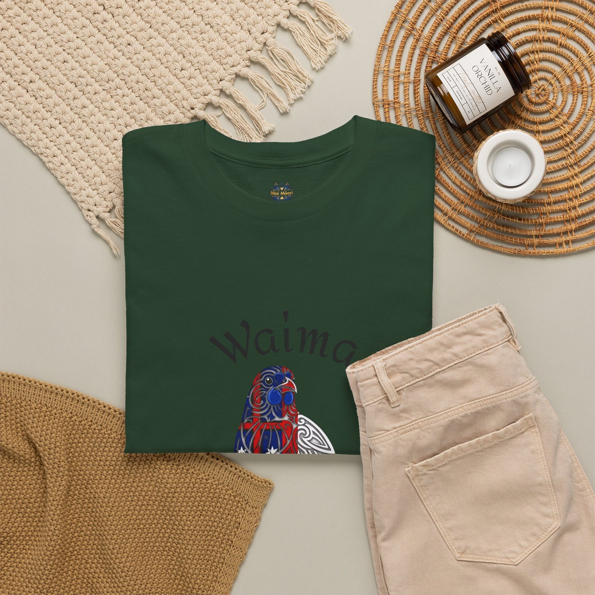 Dark green graphic T-shirt with bird illustration and partial “Wai…” text