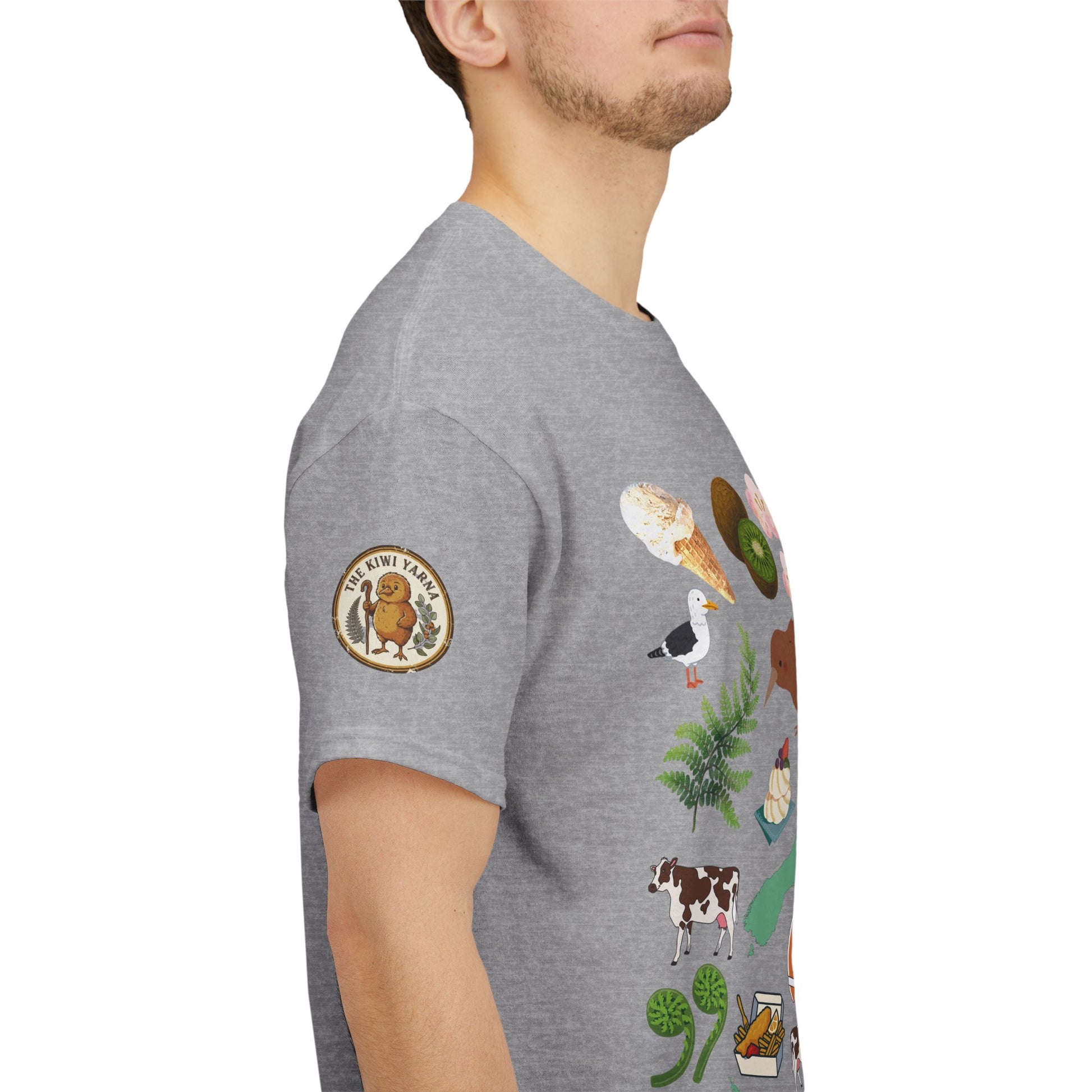 Heather grey T-shirt with circular Kiwiana logo patch on the sleeve.