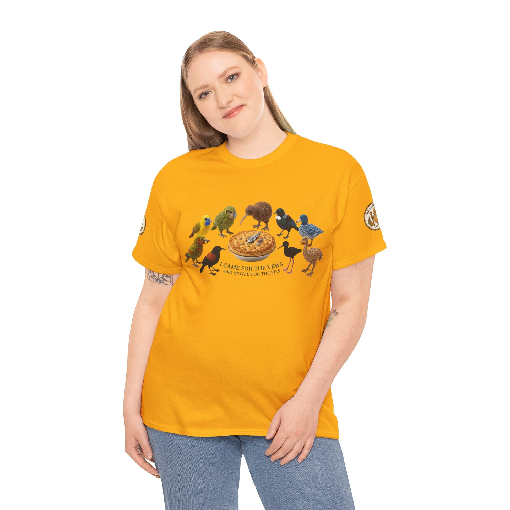 Model wearing yellow short-sleeve graphic T-shirt with birds and pizza print