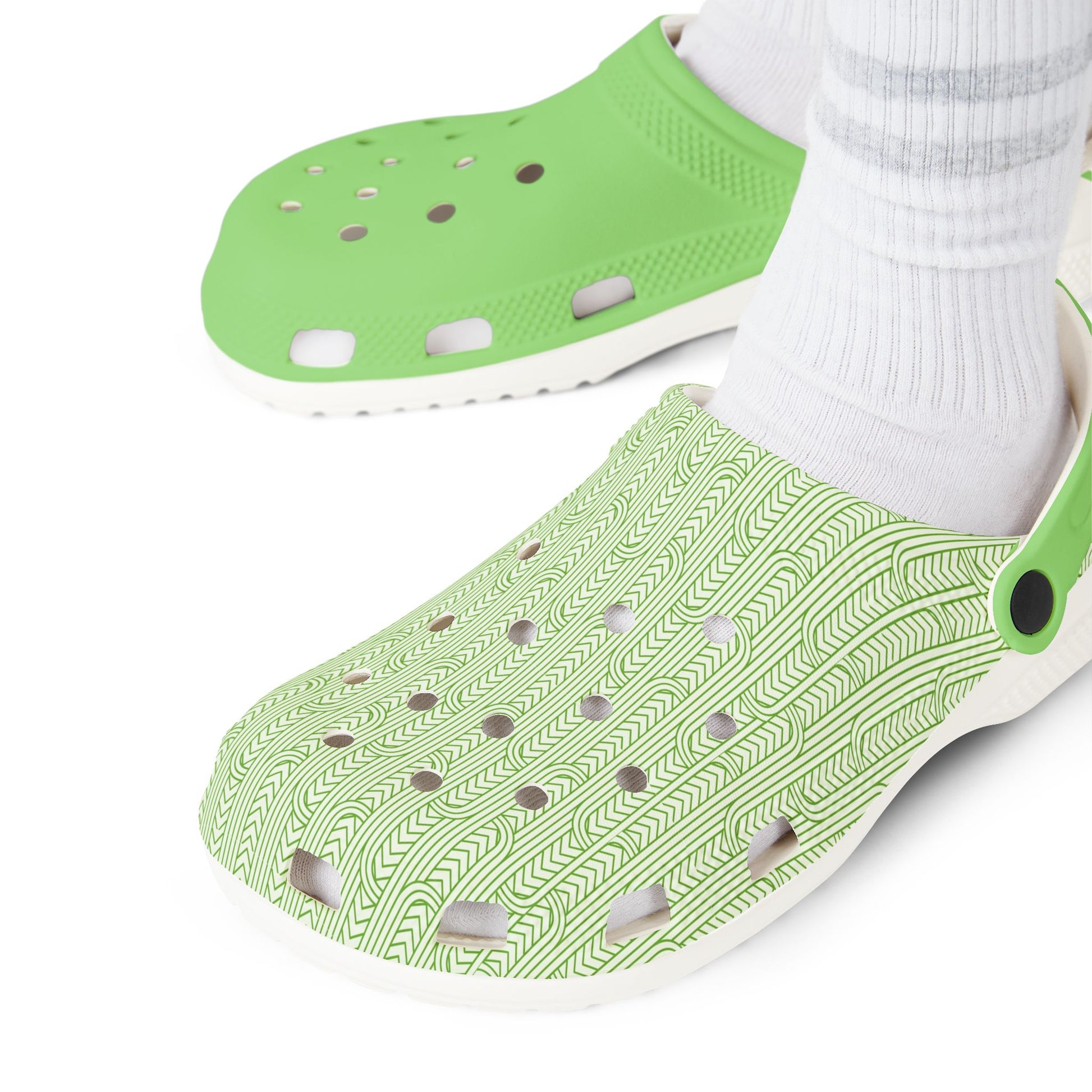 Maoritanga clogs close-up, green upper with patterned side and perforations, white sole
