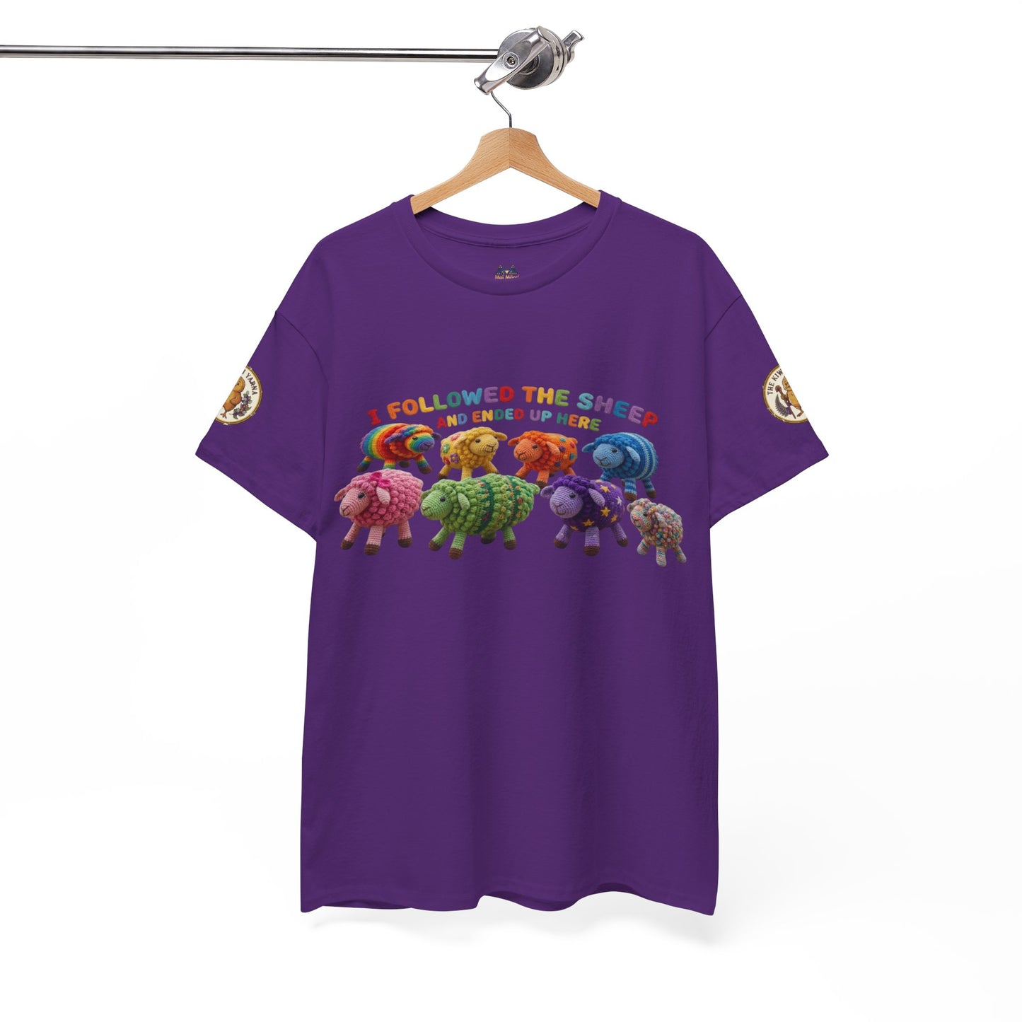 Purple graphic crewneck t-shirt with sheep illustration and rainbow text, short sleeves.
