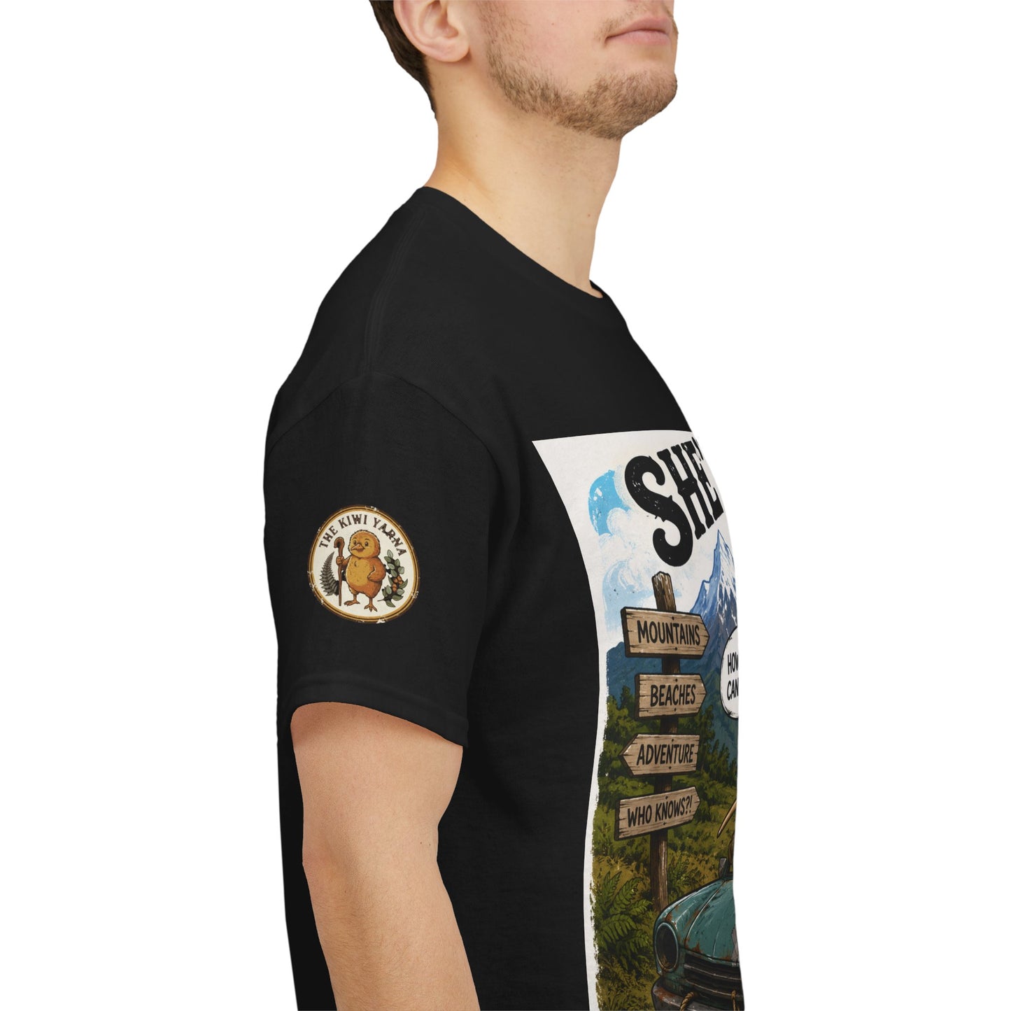 Black graphic T-shirt with circular sleeve patch and outdoor scene print on side