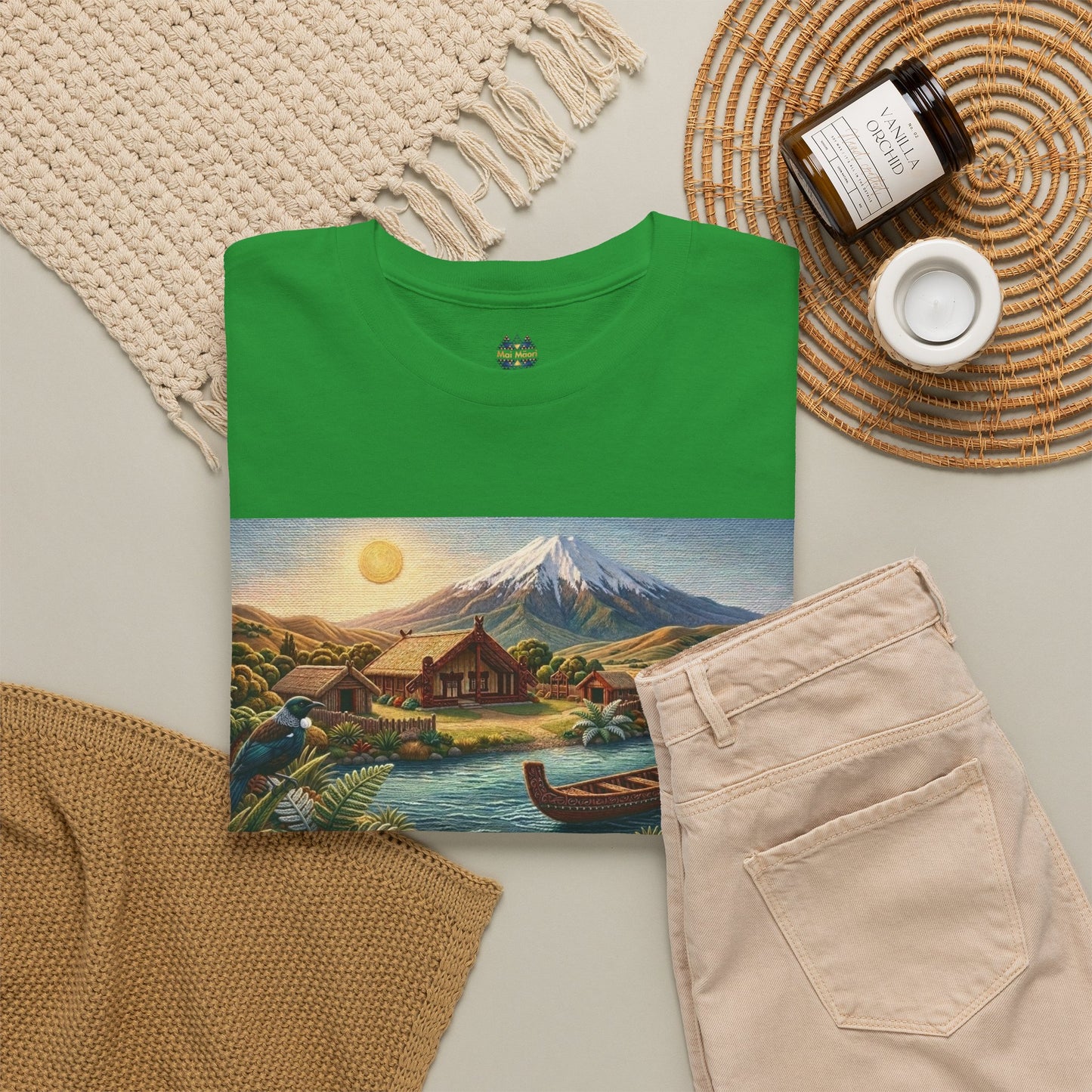 Green crew-neck T-shirt styled with accessories, featuring scenic mountain and canoe graphic.