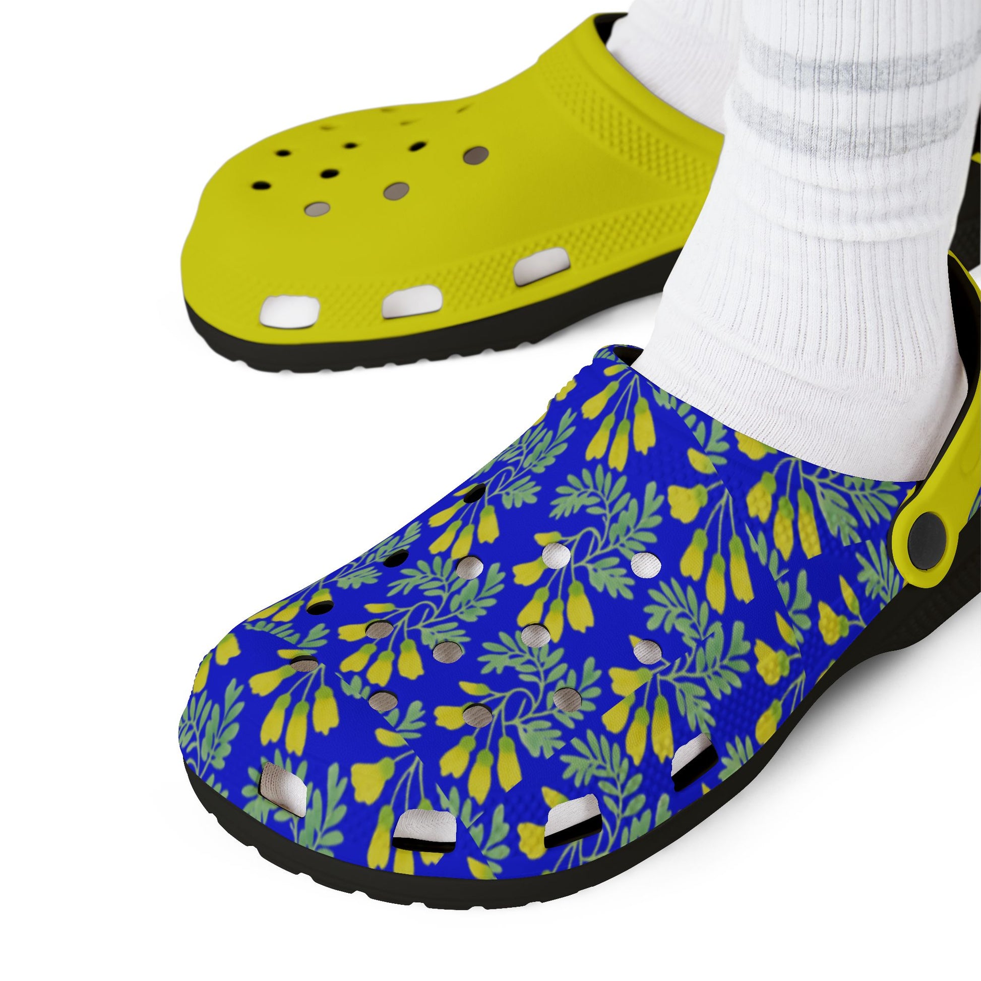 Neon yellow and blue floral clog worn with white socks.