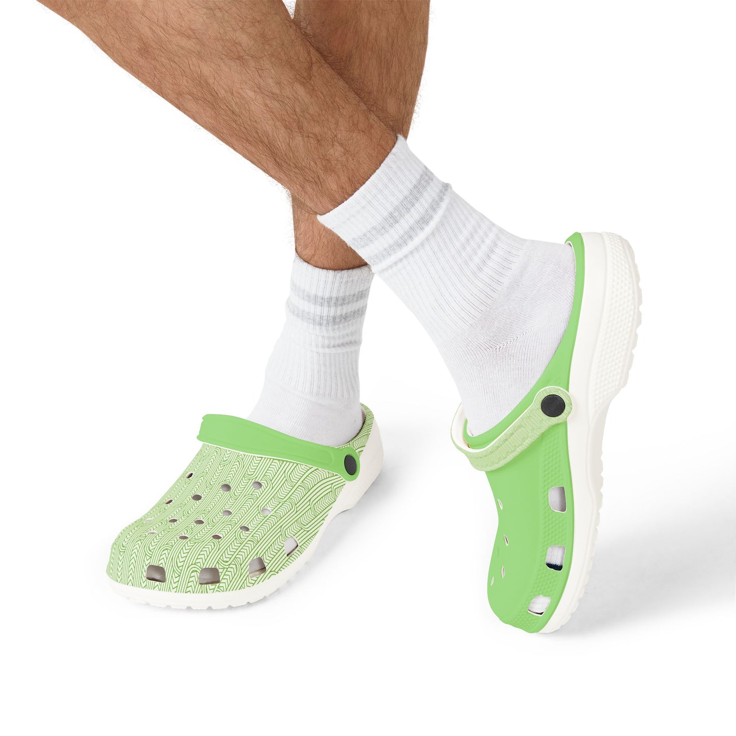 Maoritanga clogs on feet with white socks, green perforated upper and white sole
